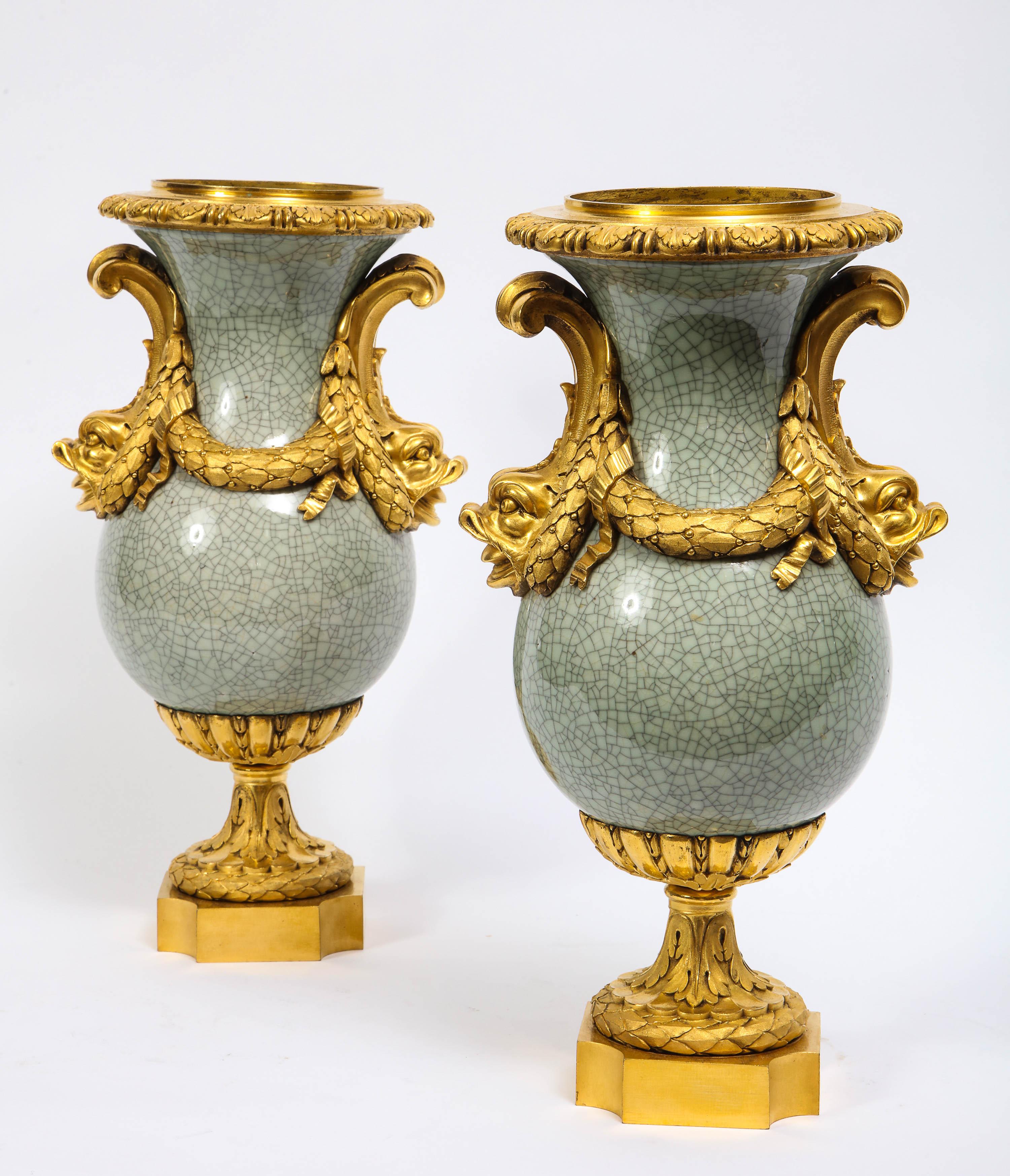 A beautiful pair of Baluster form Louis XVI style Ormolu-mounted Chinese Celadon crackle vases with dolphin handles. The porcelain was made in China between the late 1700s and early 1800s. The porcelain was then sent to France in the 19th century