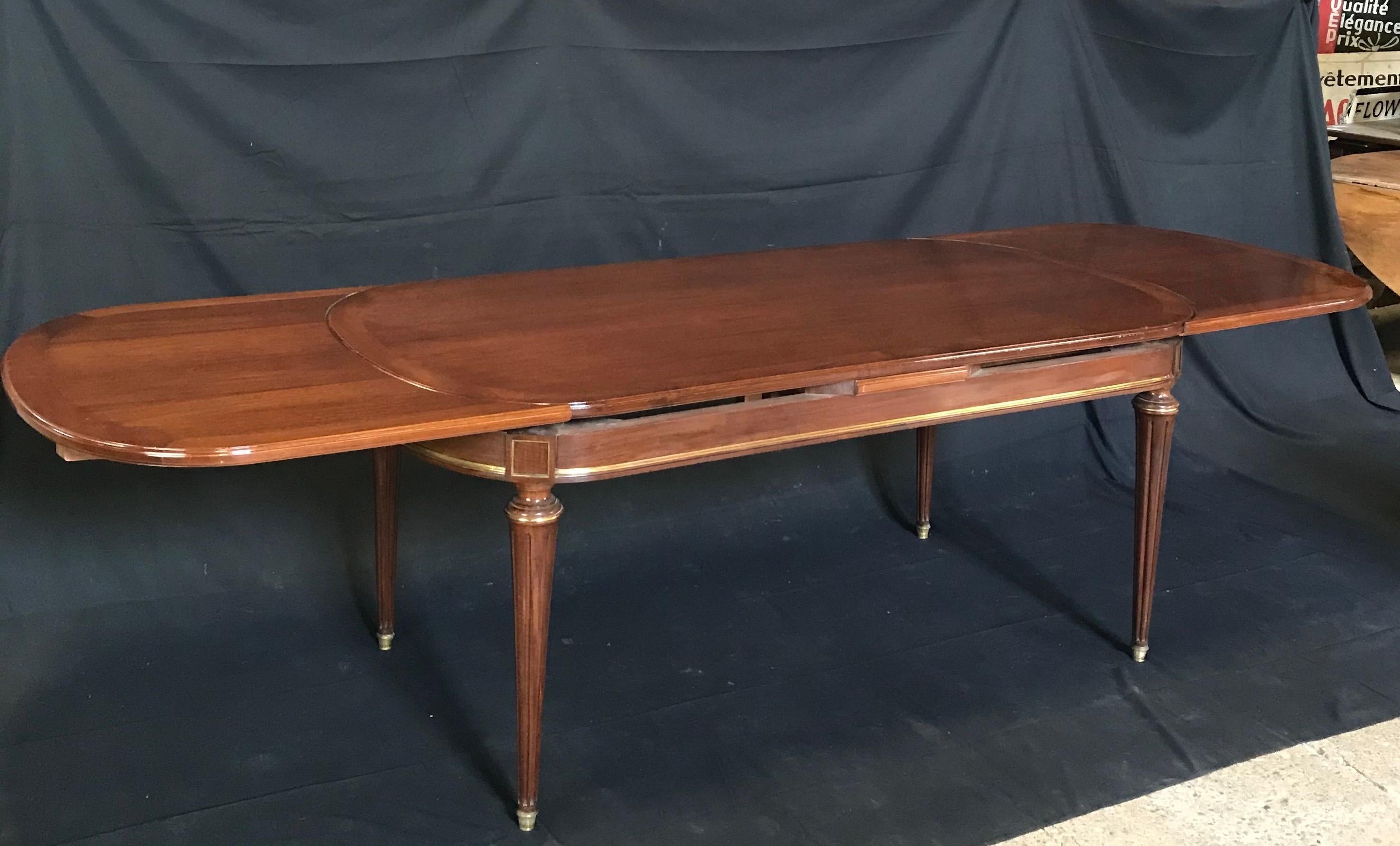 19th Century Louis XVI Oval Inlaid Fruitwood Dining Table with Two Leaves