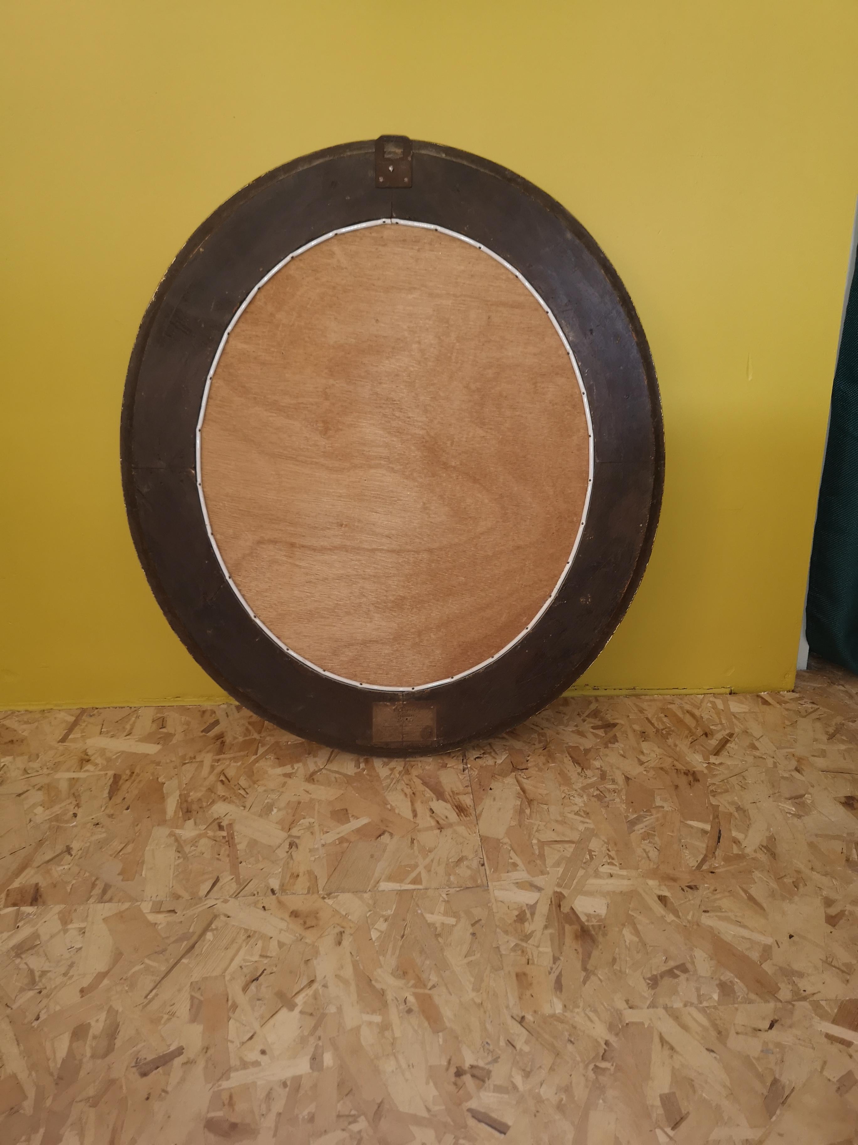 Late 19th Century Louis XVI oval mirror in gilded wood and stucco from the 19th century For Sale