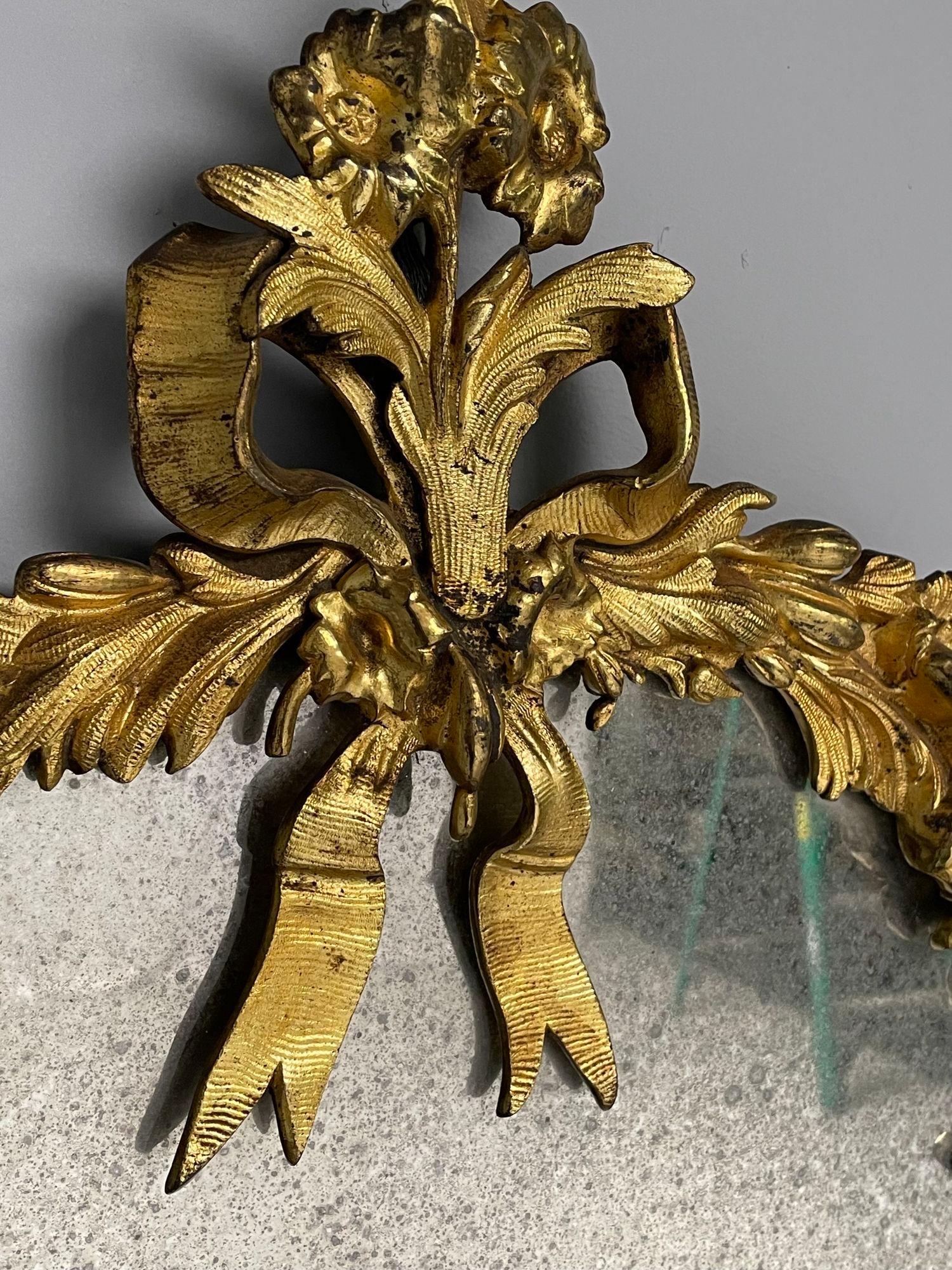 Bronze Louis XVI, miroirs muraux ovales, motifs floraux, bronze, bois sculpté, France, C.I.C. en vente