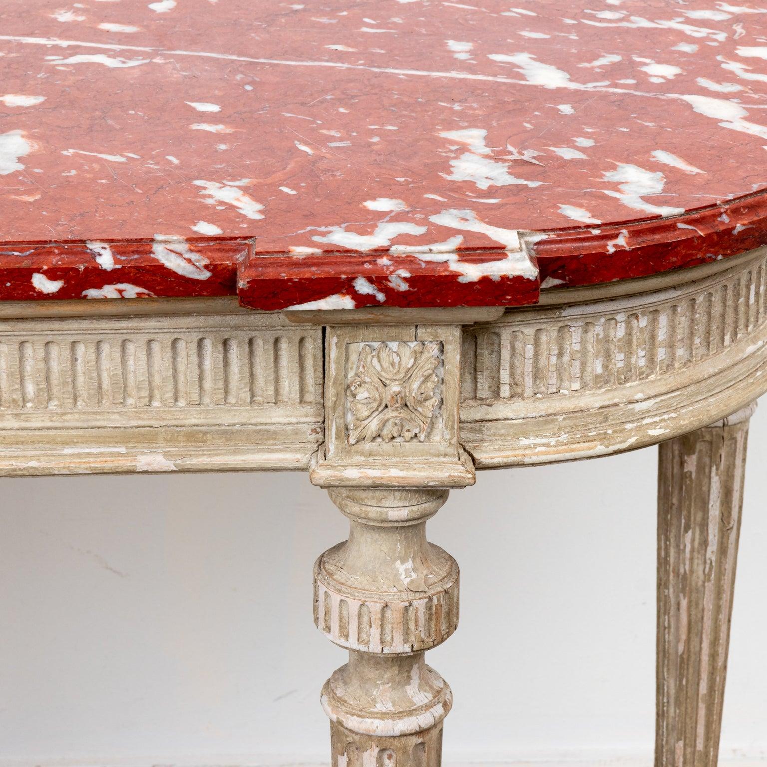 A French Louis XVI painted console table with a red marble top. Please note of wear consistent with age.

