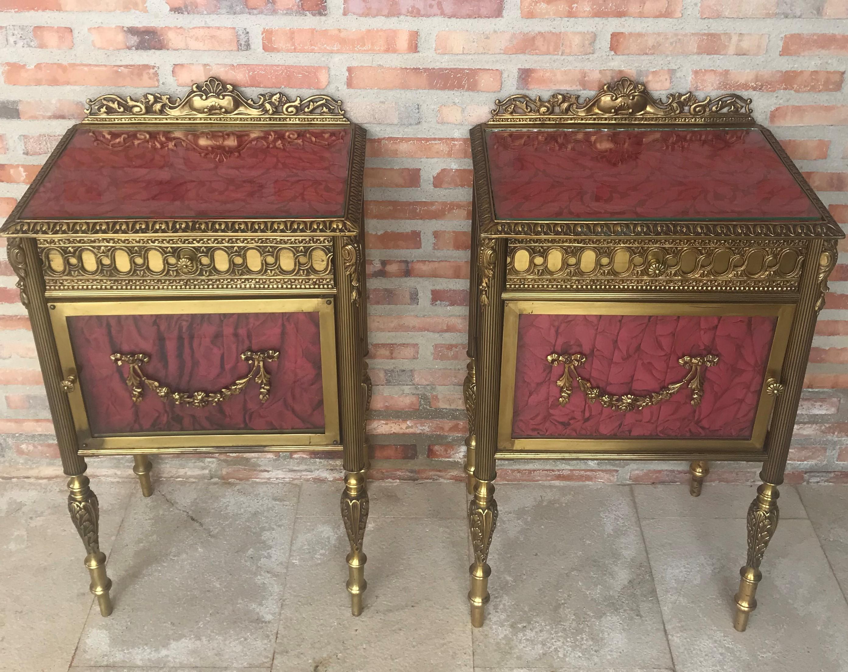 19th century pair of bronze nightstands with glass door and drawers.

This early antique Louis XVI style bronze or glass vitrine cabinet or nightstand is simply stunning and constructed of the finest quality. The bronze mounts of fine form with a