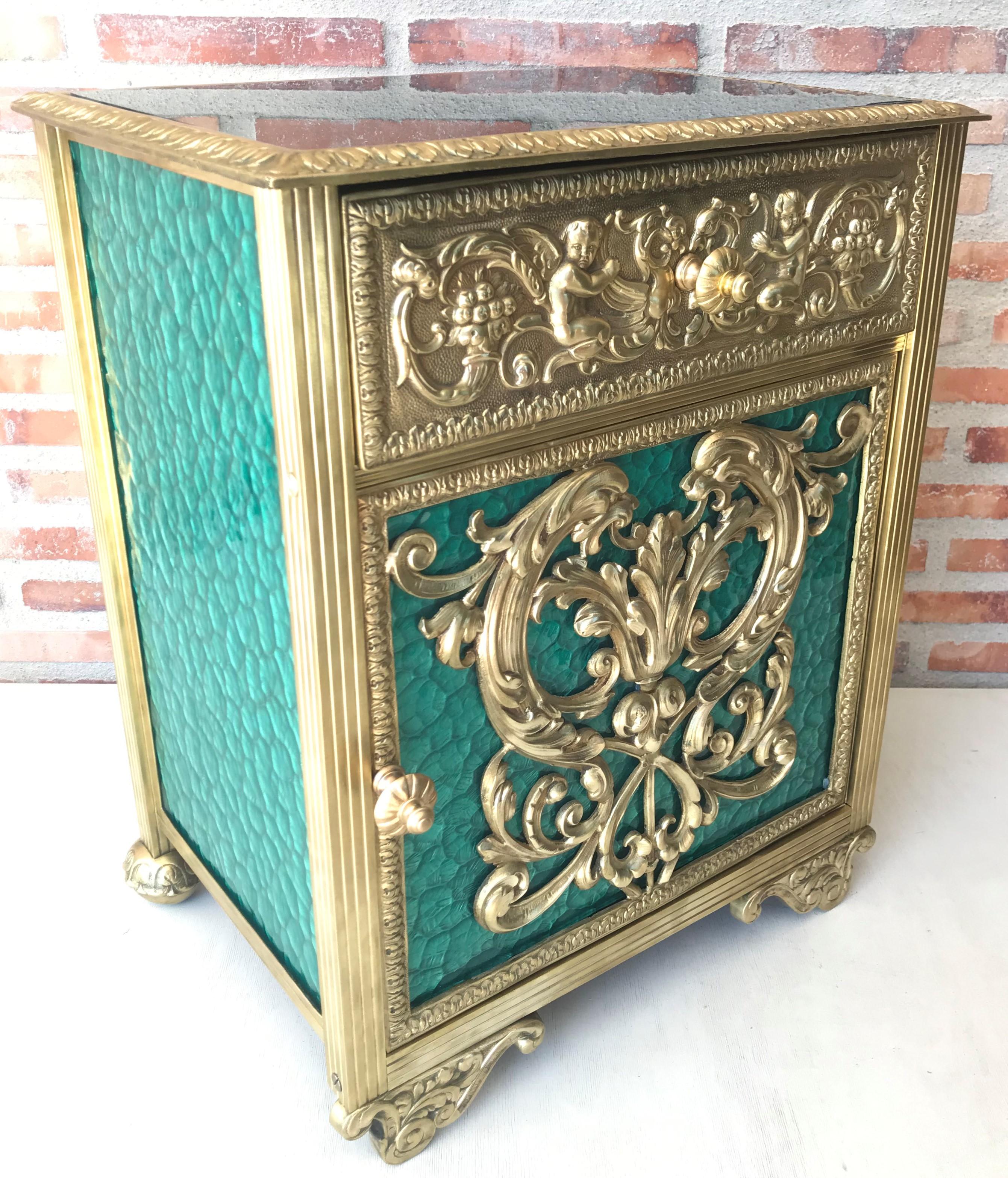 20th century pair of bronze nightstands with green glass doors and drawers.

This early antique Louis XVI style bronze or glass vitrine cabinet or nightstand is simply stunning and constructed of the finest quality. The bronze mounts of fine form