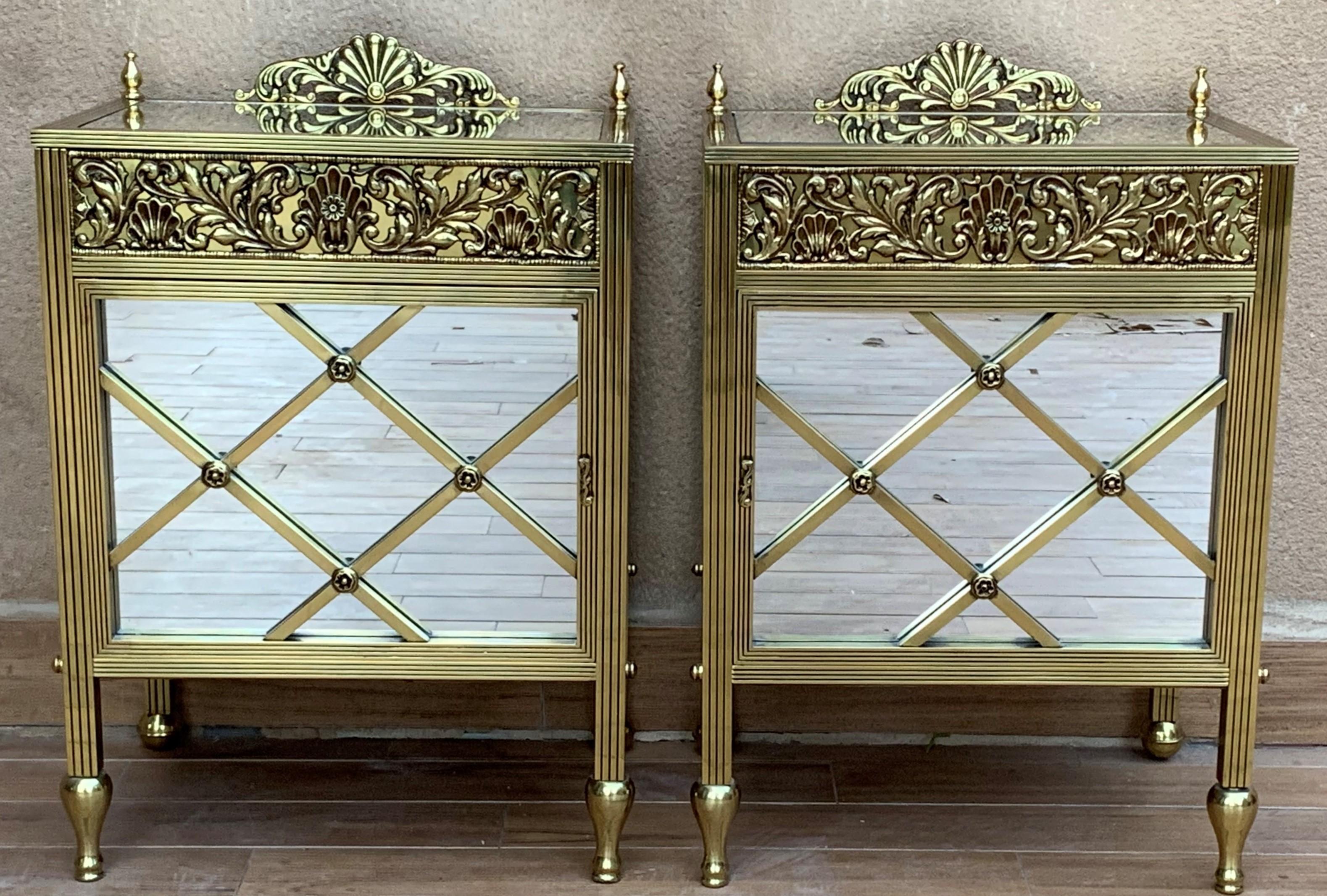 20th century pair of bronze nightstands with mirrored doors and drawers.

This early antique Louis XVI style bronze or glass vitrine cabinet or nightstand is simply stunning and constructed of the finest quality. The bronze mounts of fine form