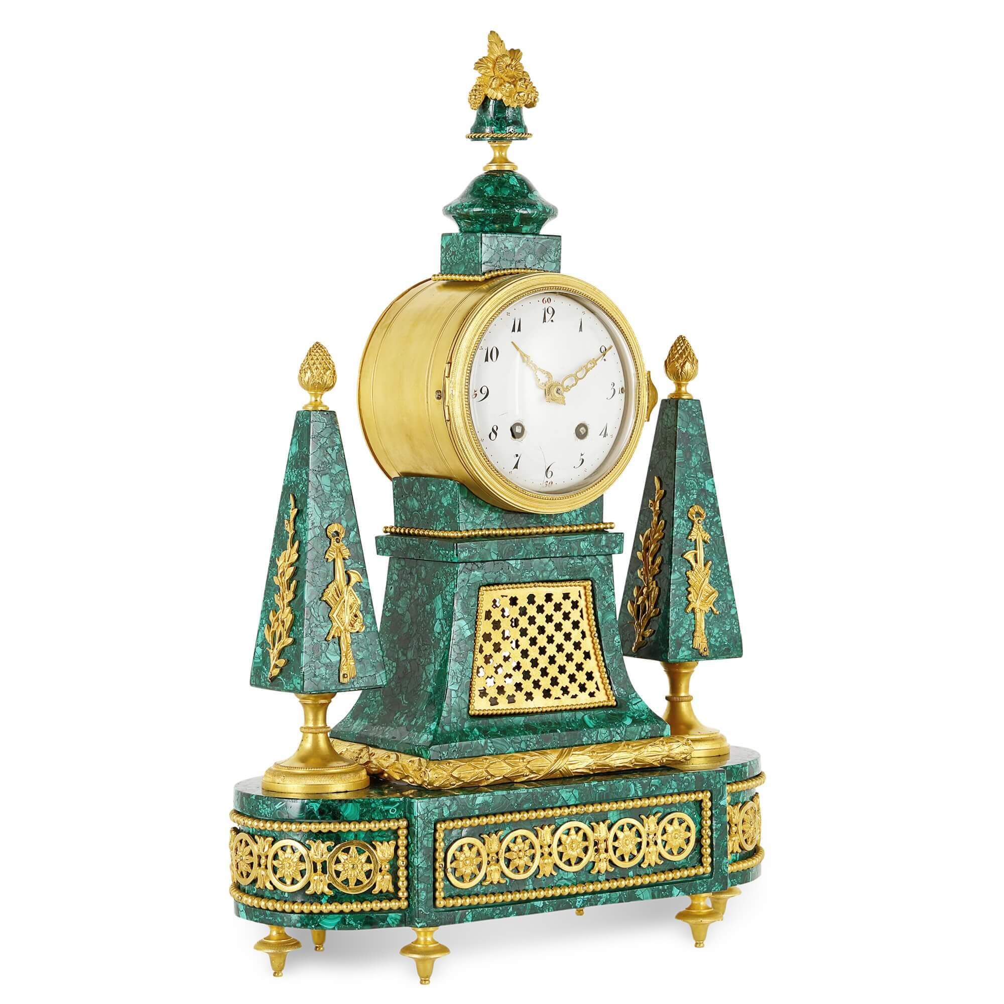 Louis XVI period gilt bronze mounted malachite clock
French, late 18th century
Measures: Height 50cm, width 34.5cm, depth 13.5cm

This fine mantel clock was produced during the era of Louis XVI. The clock is crafted from malachite and gilt