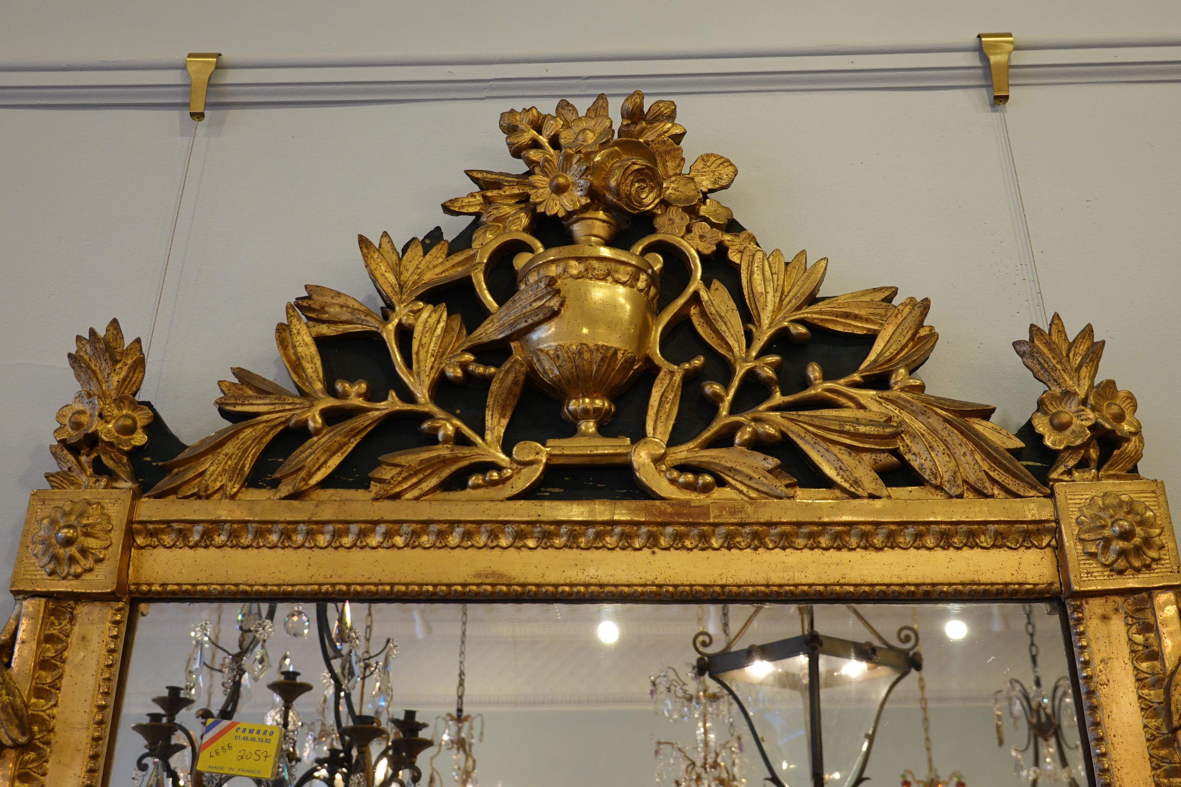 18th Century Louis XVI Period Giltwood Trumeau Mirror with Urn, Flowers and Laurel Leaves For Sale