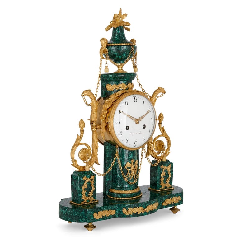 Louis XVI period neoclassical ormolu and malachite mantel clock
French, Late 18th Century
Measures: Height 53cm, width 36cm, depth 14cm

Encapsulating the stylistic refinement and grace of the Louis XVI period and the emergence of the