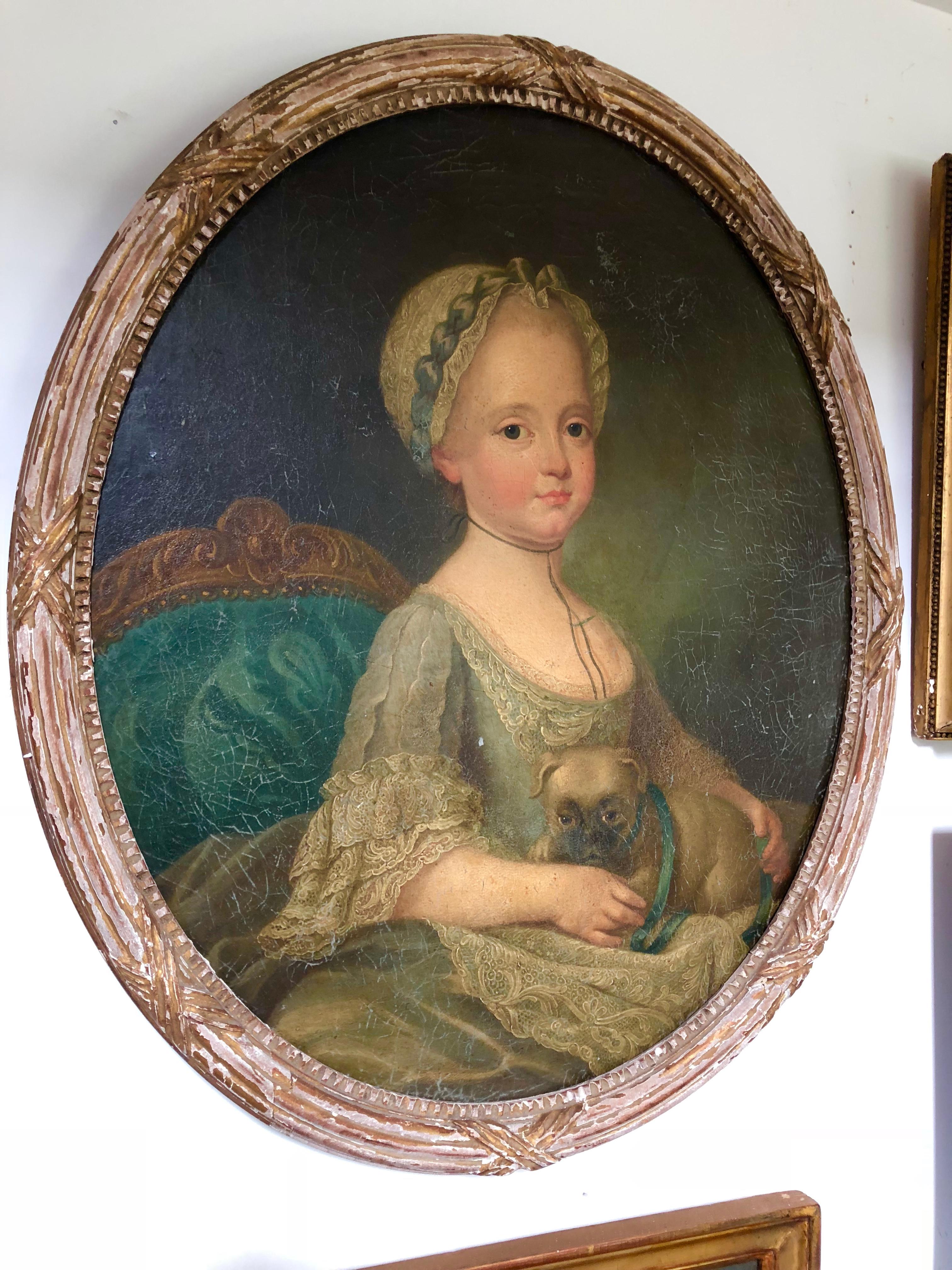A charming oval portrait of a young girl with her pet pug, oil-on-canvas, late 18th century, French. From the estate of Pierre Moulin founder of Pierre Deux French Country.