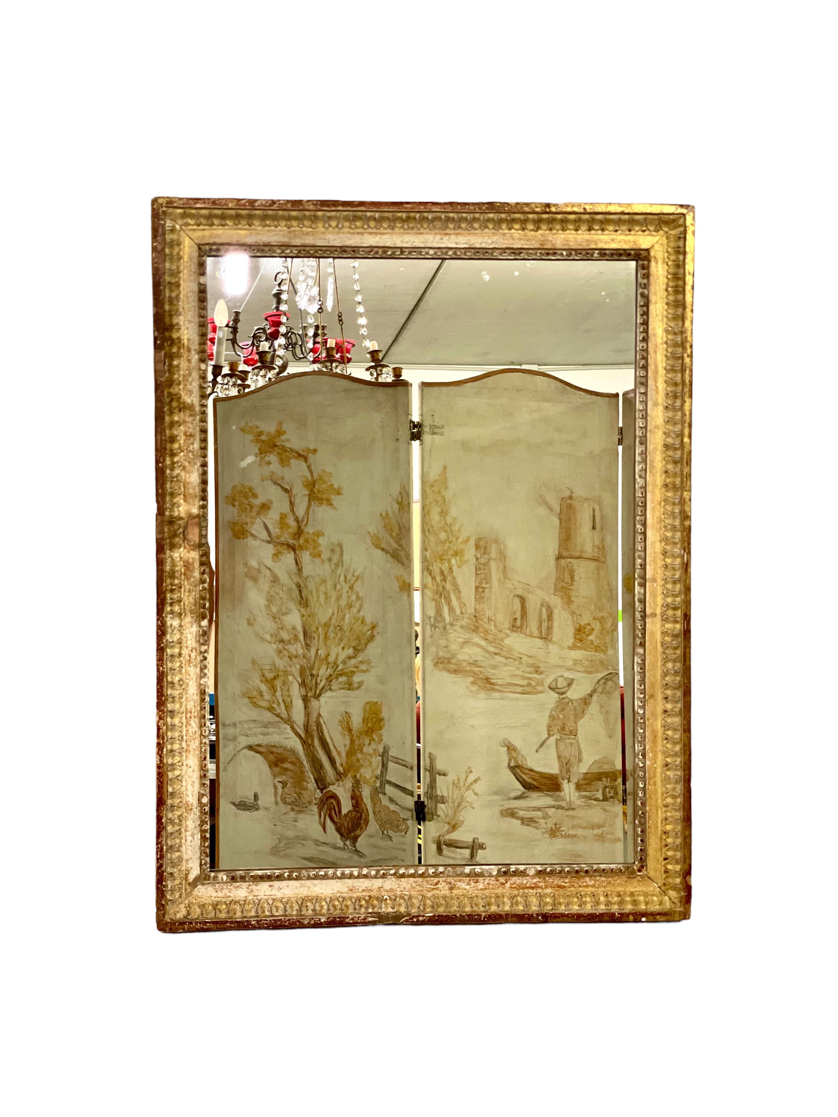 This 18th century Louis XVI baguette frame giltwood mirror is full of vintage character, and features a slim but beautifully carved frame embellished with bands of carved decoration and string-of-pearl beading around the mirror plate. Touches of