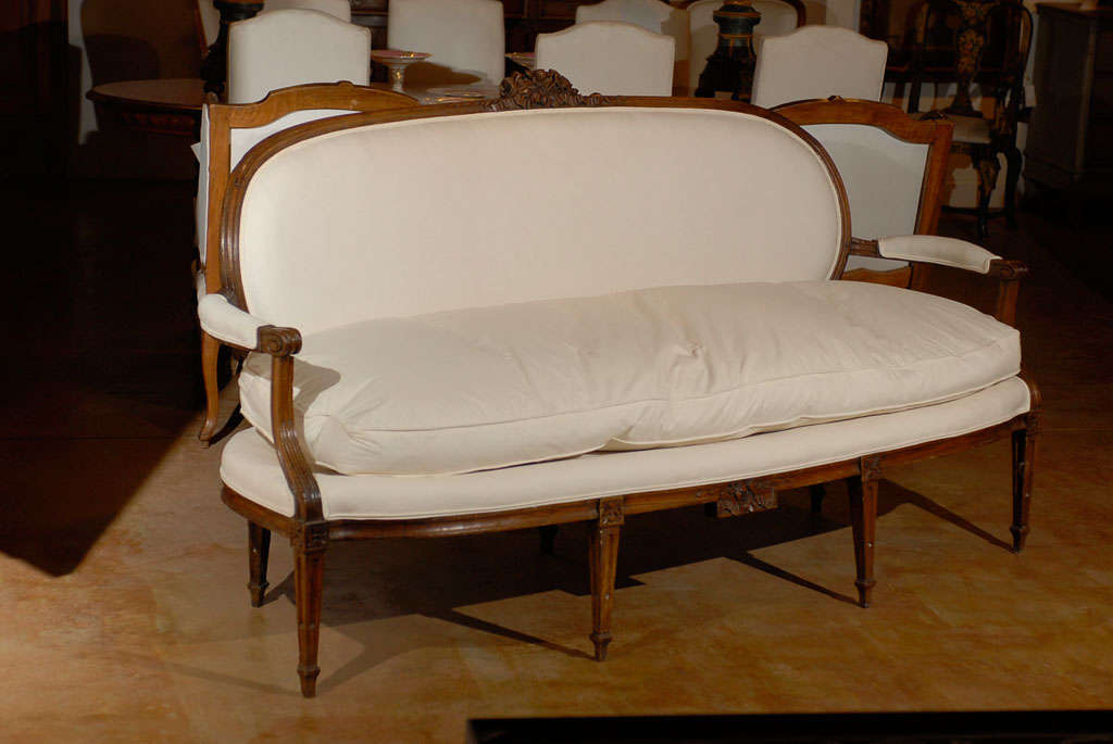A French Louis XVI period Provençal sofa from the late 18th century, signed by Pillot from Nîmes with new cotton upholstery. Created by Pierre Nicolas Pillot, cabinet-maker who worked in the South of France at the end of the 18th, early 19th