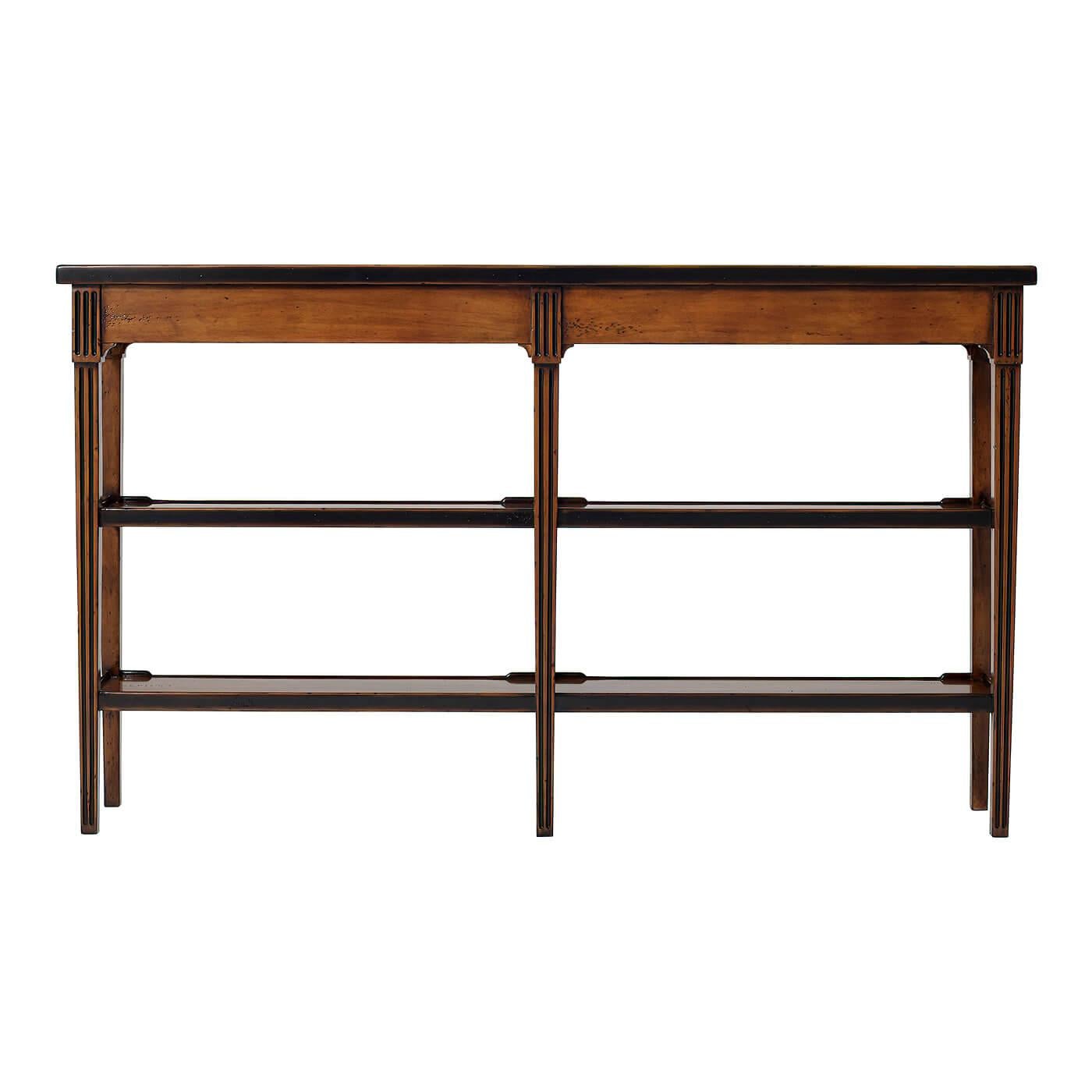A French Provincial rustic honey finish console table, the rectangular three quarter gallery top with an ebonized edge, above four fluted frieze drawers, on square fluted legs, joined by two tiers. 

Dimensions: 58