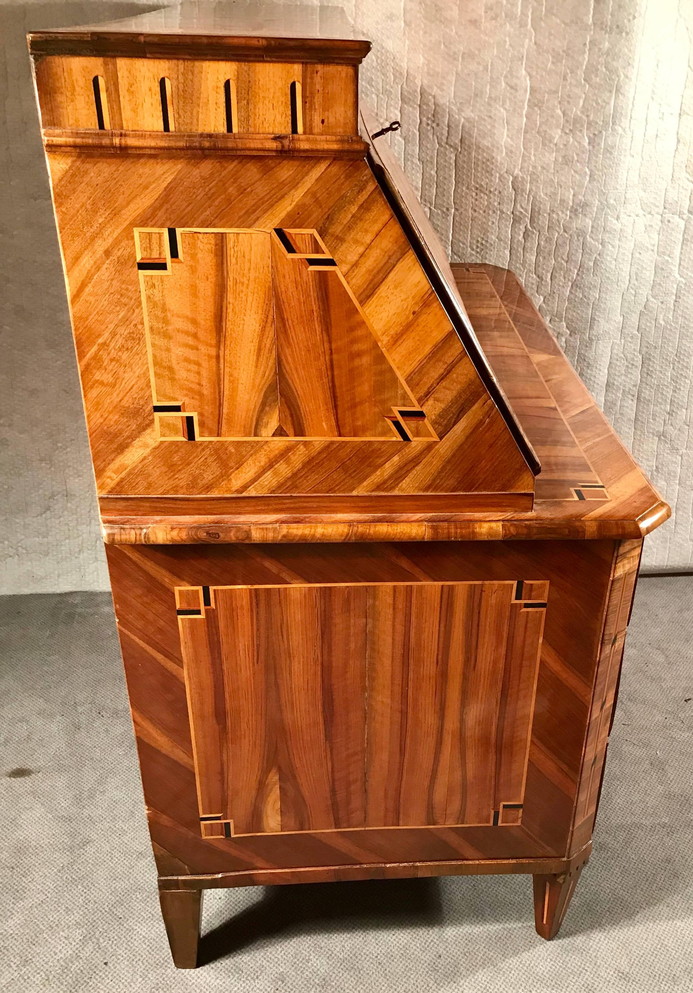 Elegant Louis XVI secretaire, France, 1780, walnut veneer with marquetry in elmwood. In excellent, restored condition. The secretaire will be shipped from Germany, shipping costs to Boston are included.