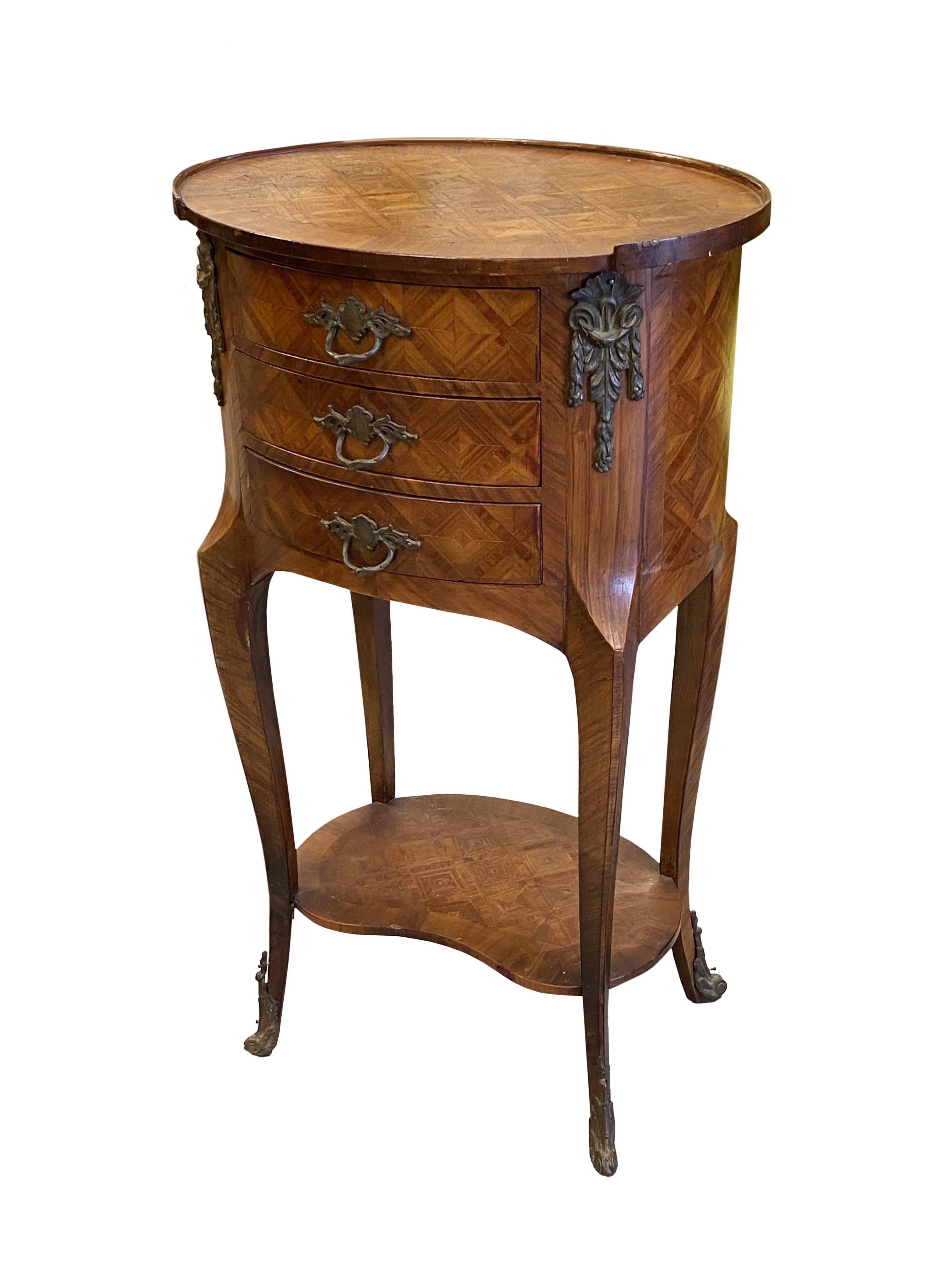 Louis XVI marquetry inlay side table with bronze mounts and pulls, feet are bronze sabot. With wood gallery edge. Inlaid shelf and three drawers. Can float in room finished all the way around. Circa 1800s, France.