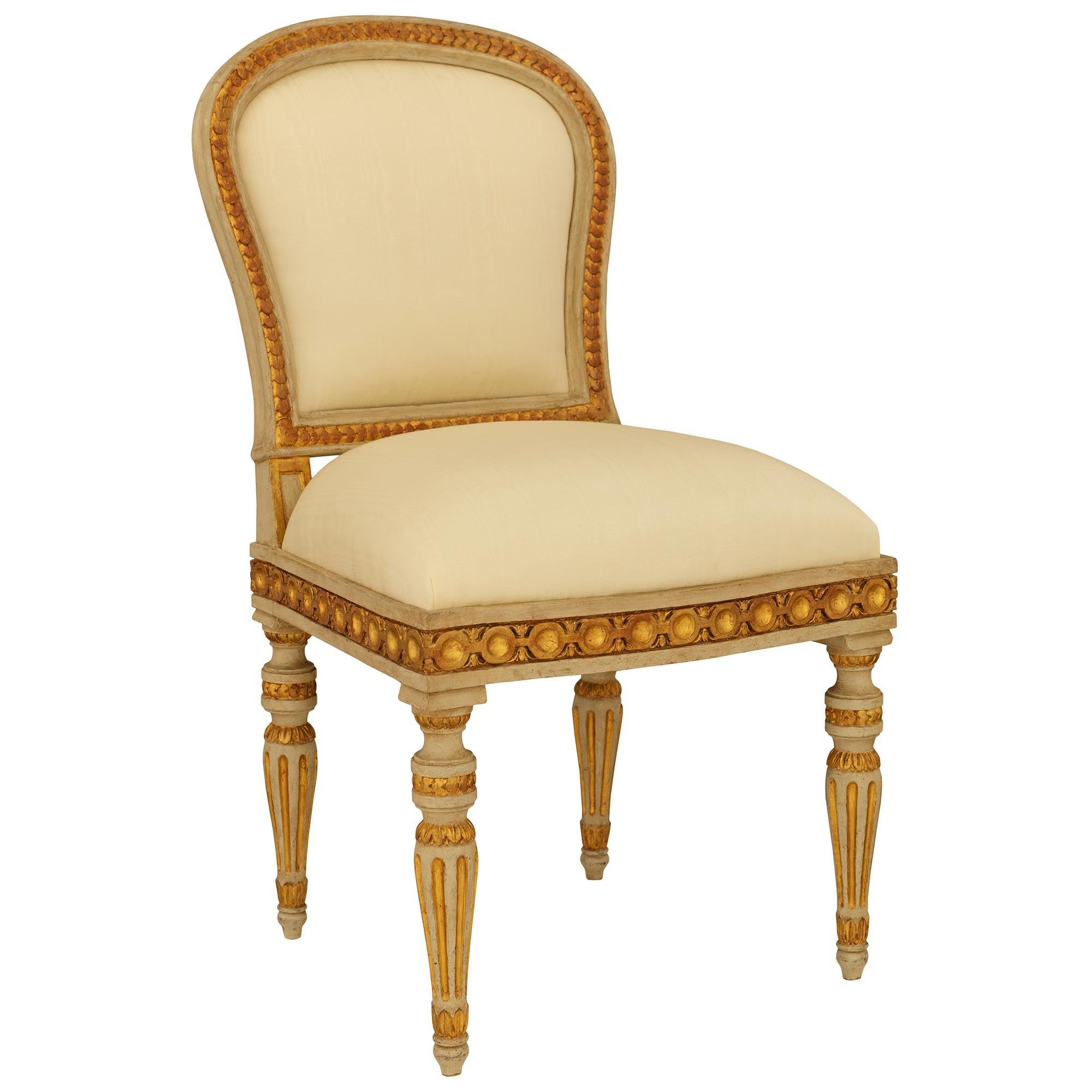 Italian Louis XVI st. patinated Wood and Giltwood ‘A Chassis’ dining chairs For Sale