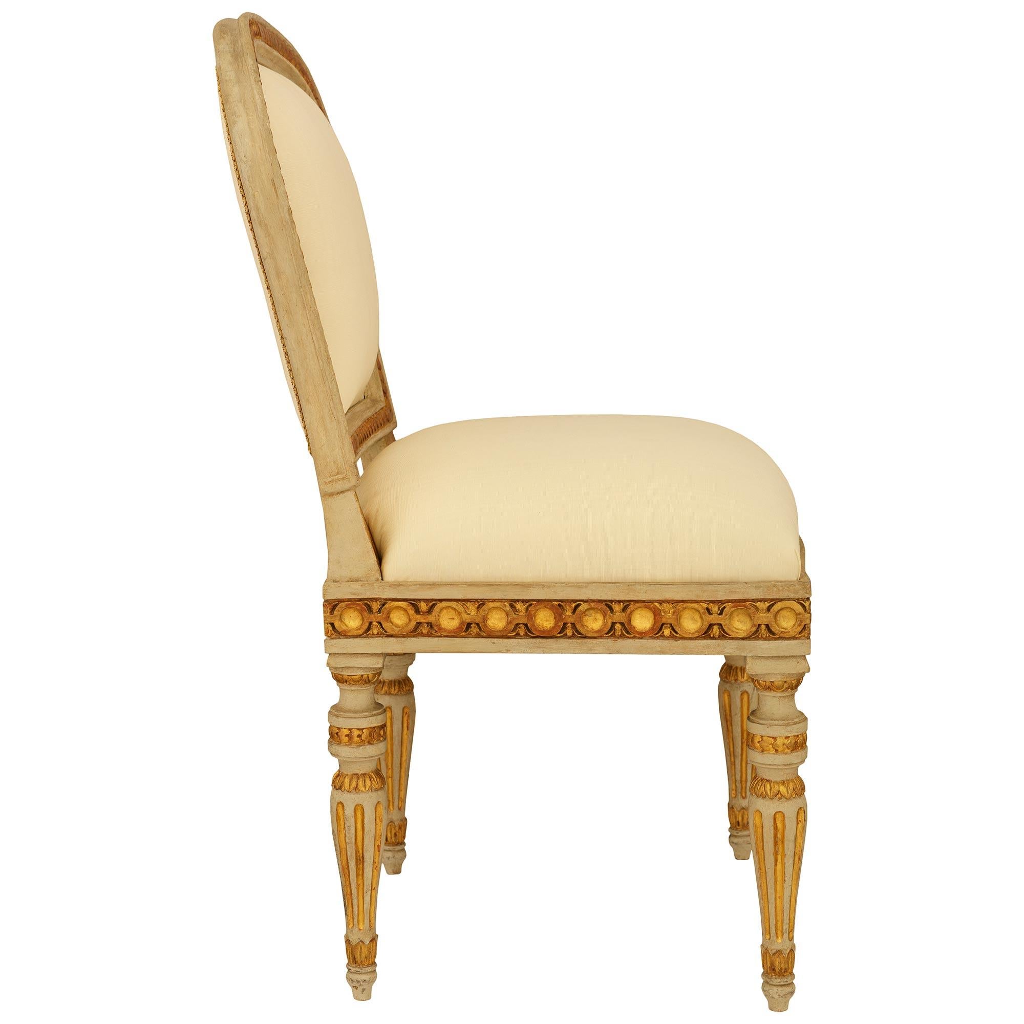 Patinated Louis XVI st. patinated Wood and Giltwood ‘A Chassis’ dining chairs For Sale