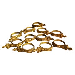 11 anneaux de rideau français de style Louis XVI en bronze doré et ciselé