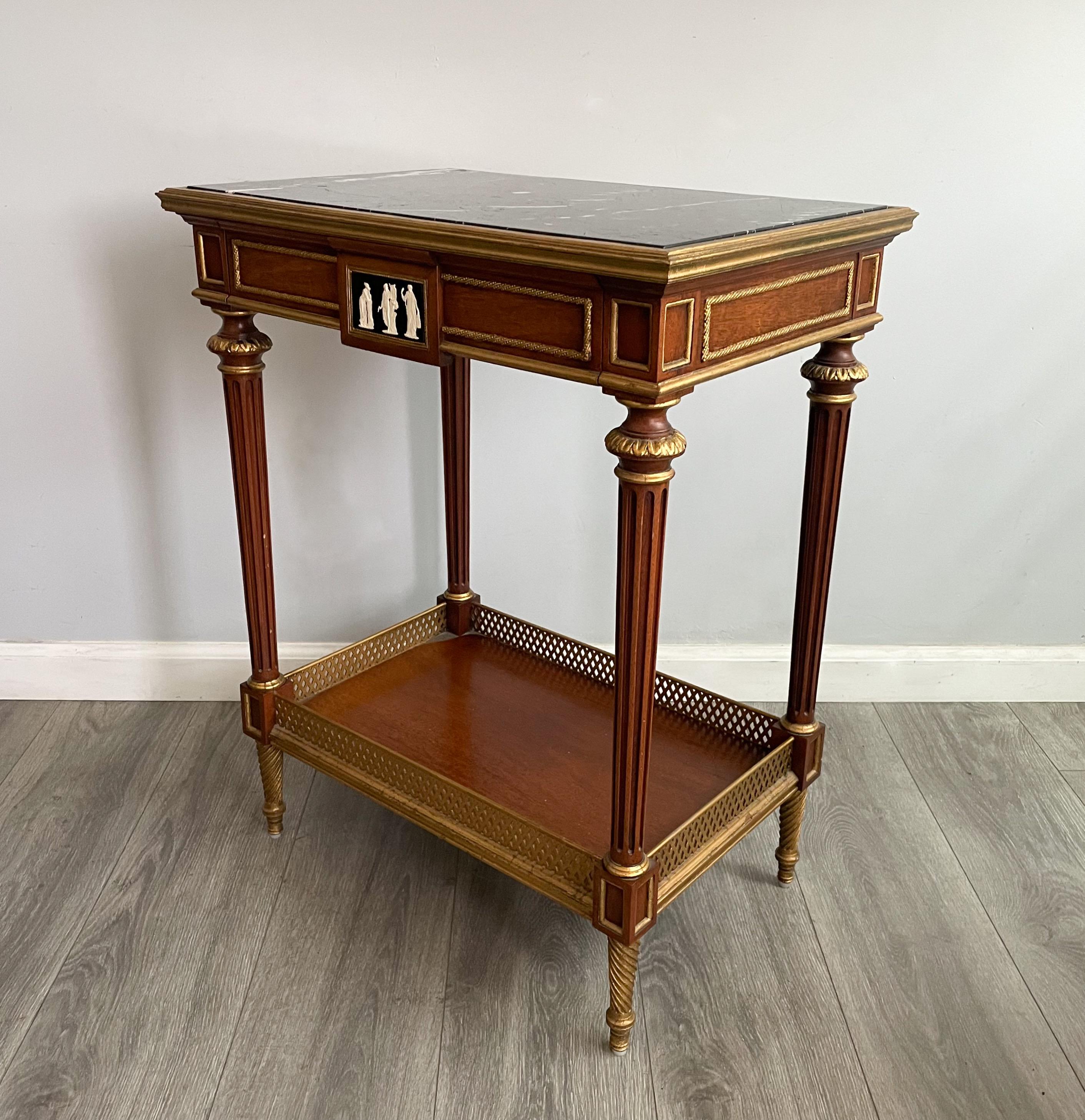 From the Newport Historic Collection by EJ Victor, North Carolina.

Occasional table with inset marble top, one drawer with Neoclassical cameo decoration, faux drawer verso with complementing decoration, above a lower gallery, with fluted and