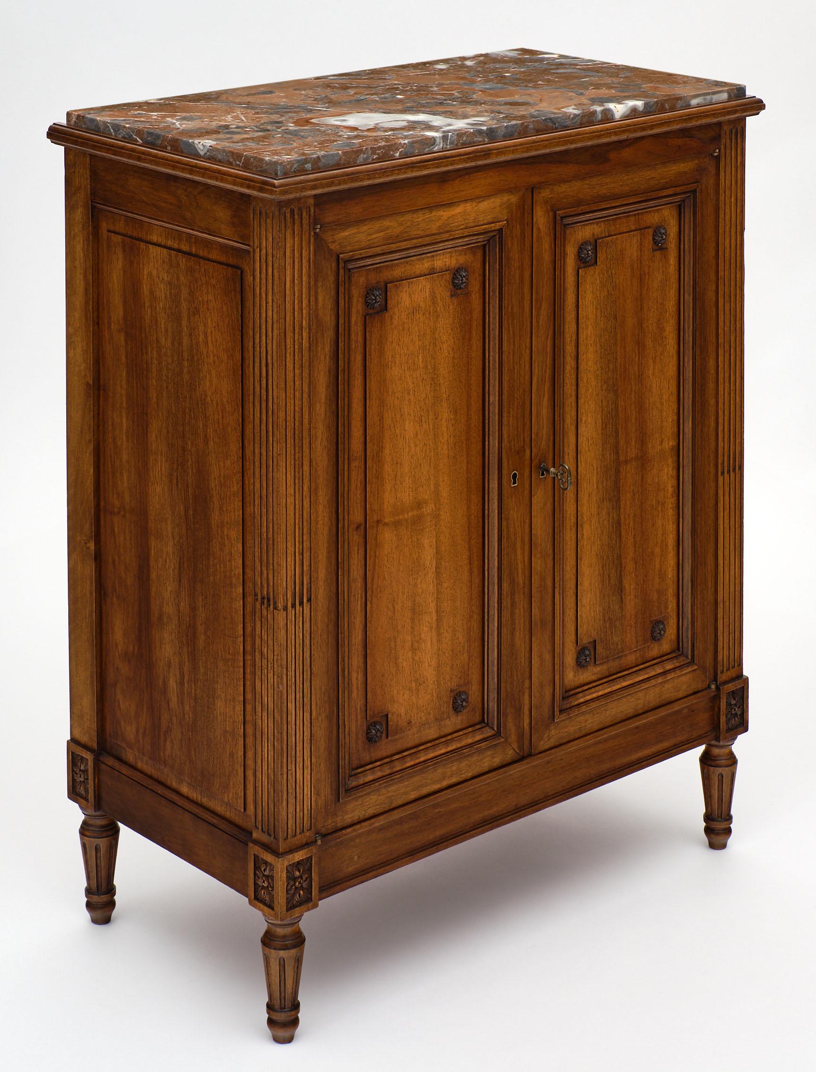 Louis XVI style “argentier” with marble top. This charming, solid walnut cabinet opens to reveal three dovetailed drawers and is accented by a beautiful brêche marble top. A very tightly built “argentier” meant originally to contain silverware.