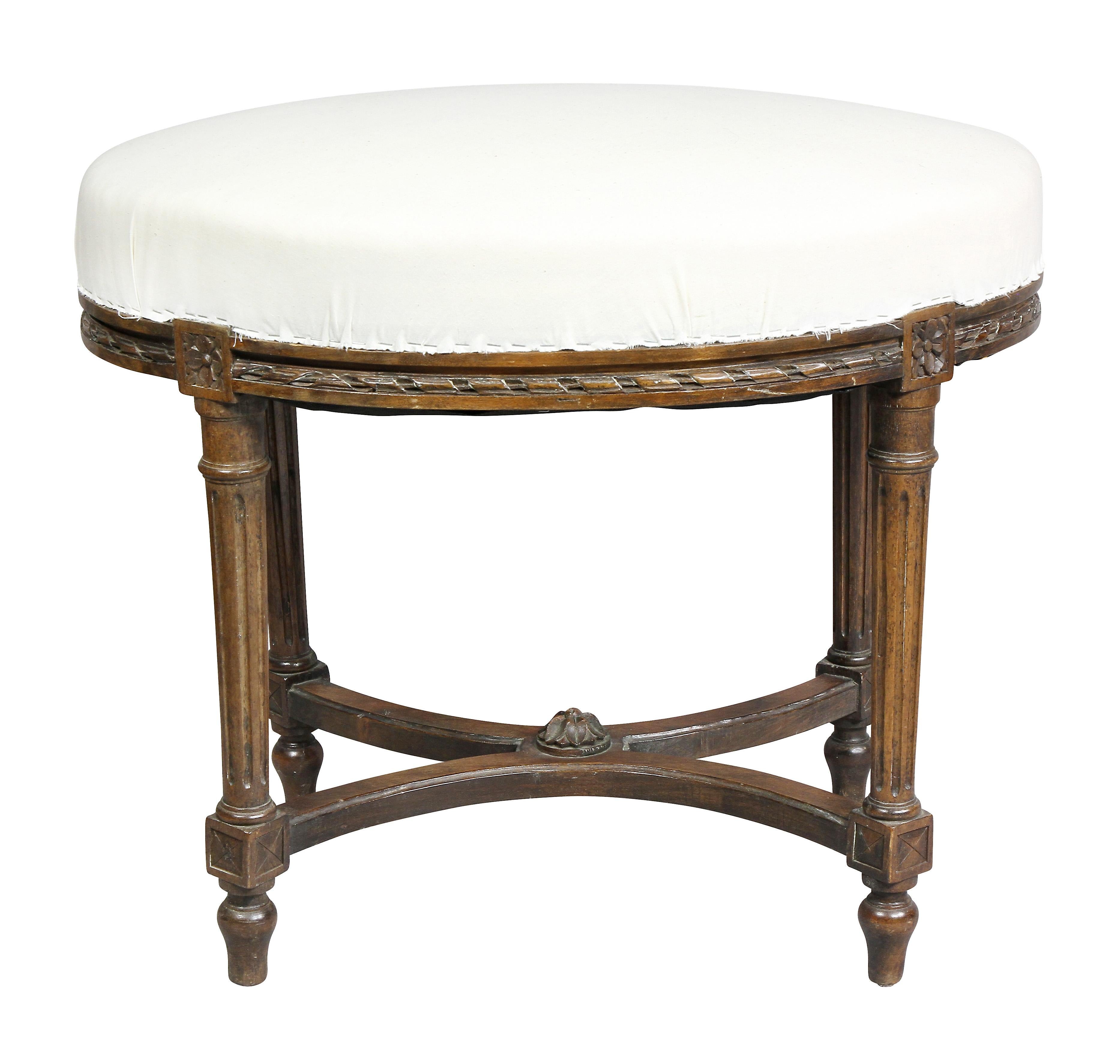 Oval with new muslin seat raised on tapered fluted legs and X form stretcher, toupie feet.