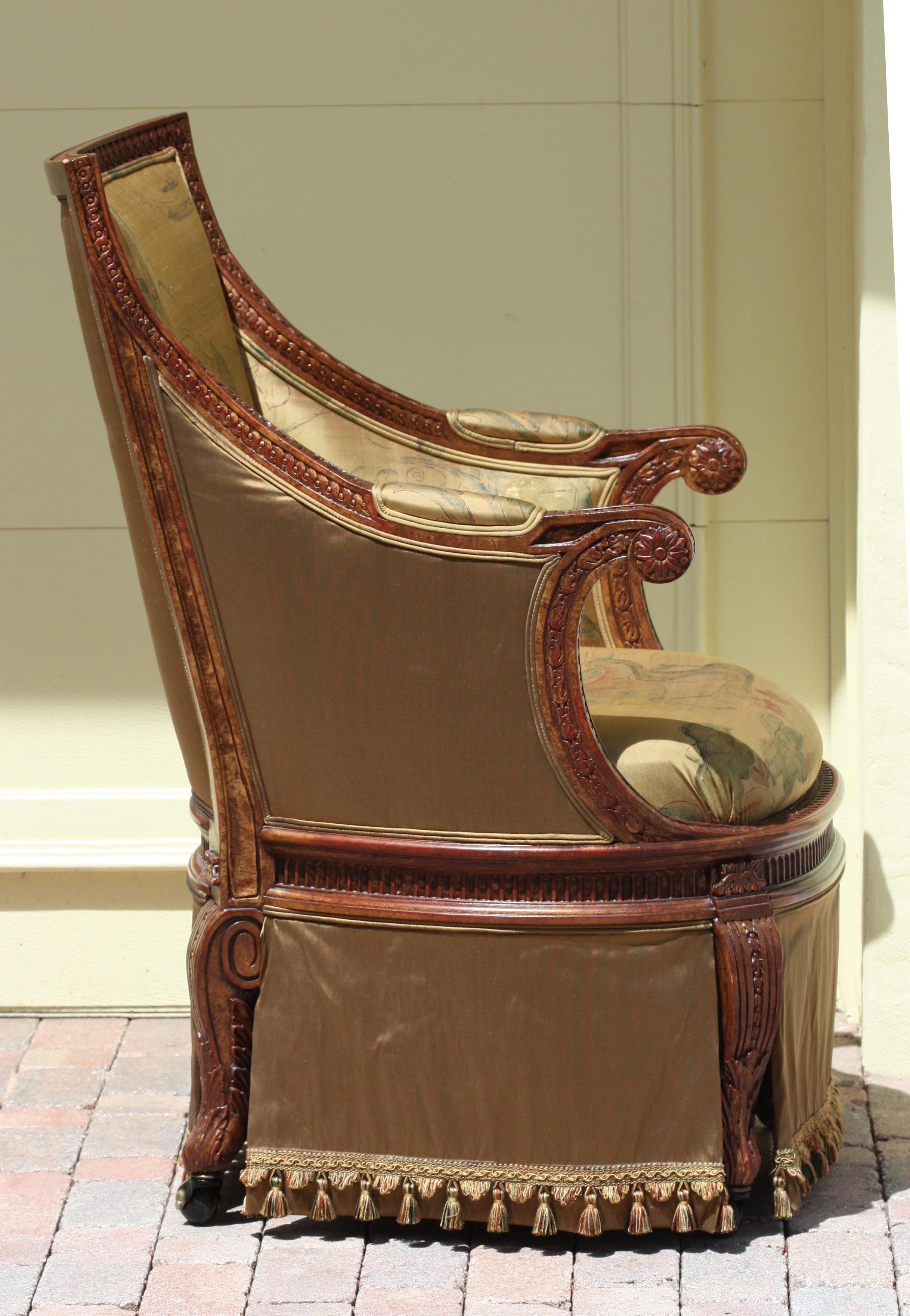 
Louis XVI Style Beech Wood Desk Chair 
The curved back and arms are carved with leaf-tips and interlaced links, on a revolving support, on similarly carved S-scrolled legs, with a skirt from seat to floor, upholstered in a printed blended