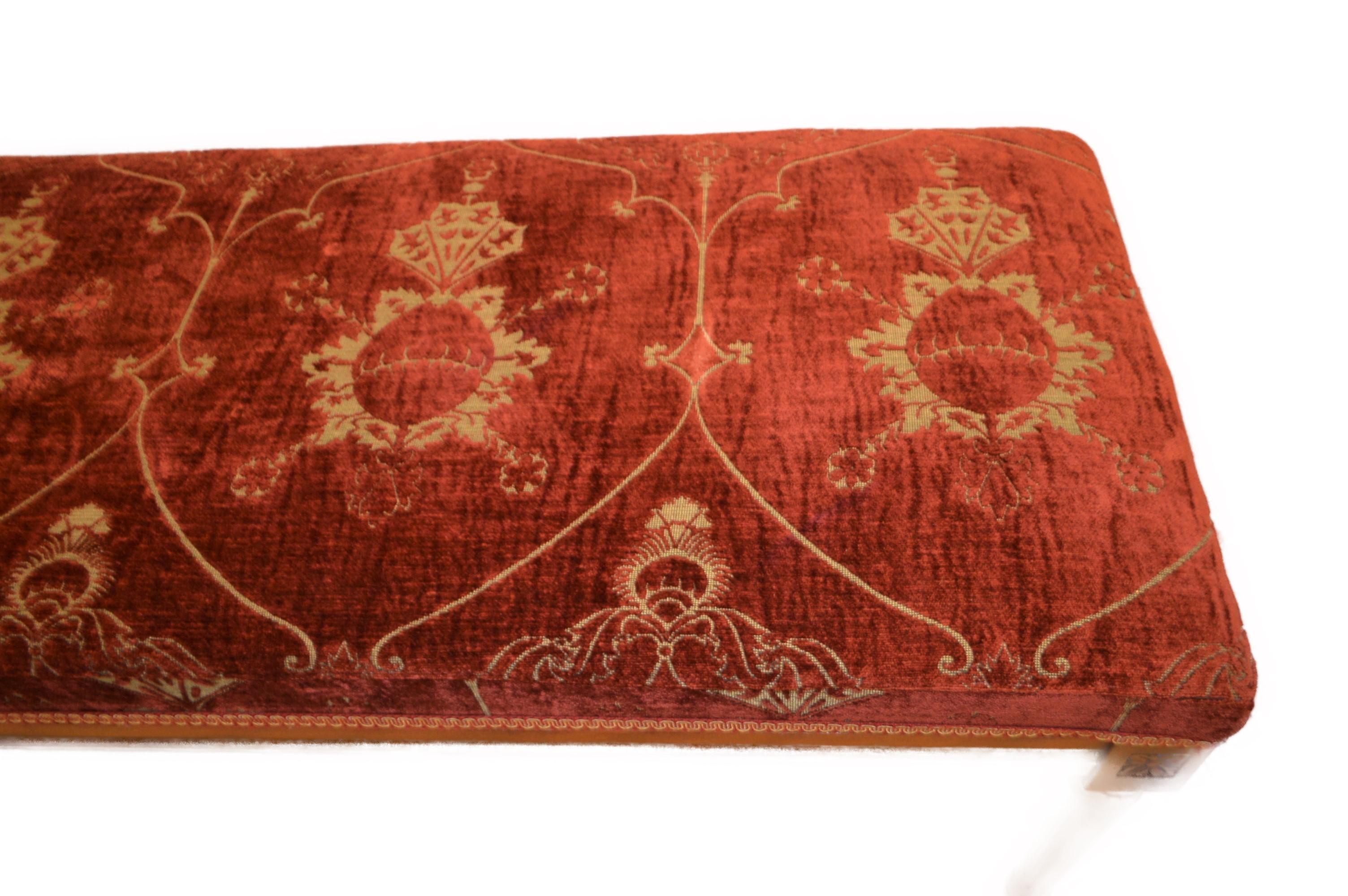 Italian Louis XVI style bench upholstered with a red antique chenille fabric.