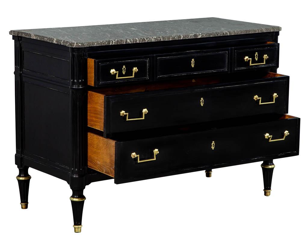 Louis XVI style black lacquered commode chest. Restored by the Carrocel artisans in a hand polished black lacquer finish. Featuring original brass hardware and marble top.

Price includes complimentary curb side delivery to the continental USA.