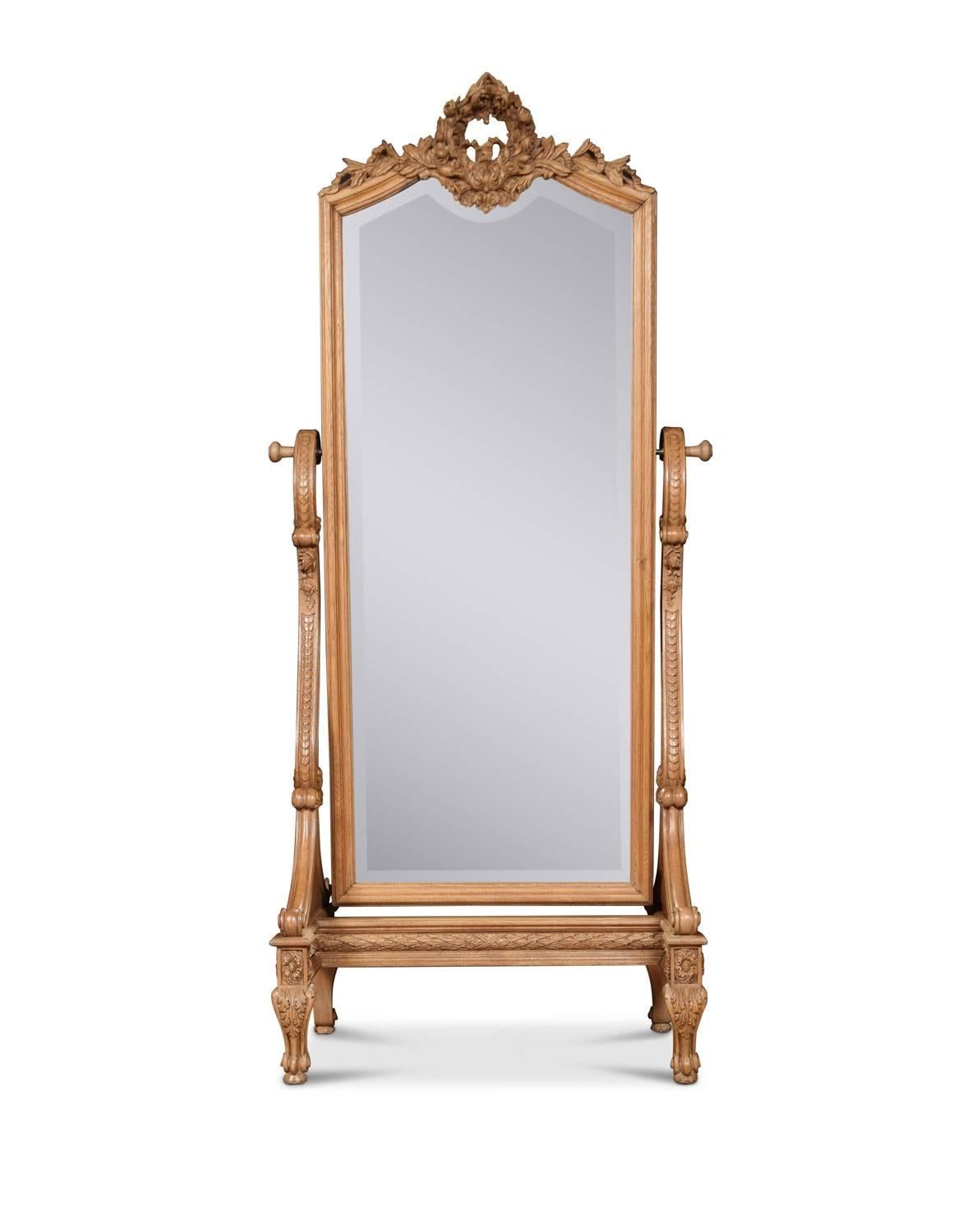 Blonde oak cheval mirror, the large rectangular bevelled mirror encased in oak frame with floral carved pediment. Supported on two scrolled carved supports, all raised up on four acanthus capped toupee feet.
Dimensions:
Height 72.5 inches
Width