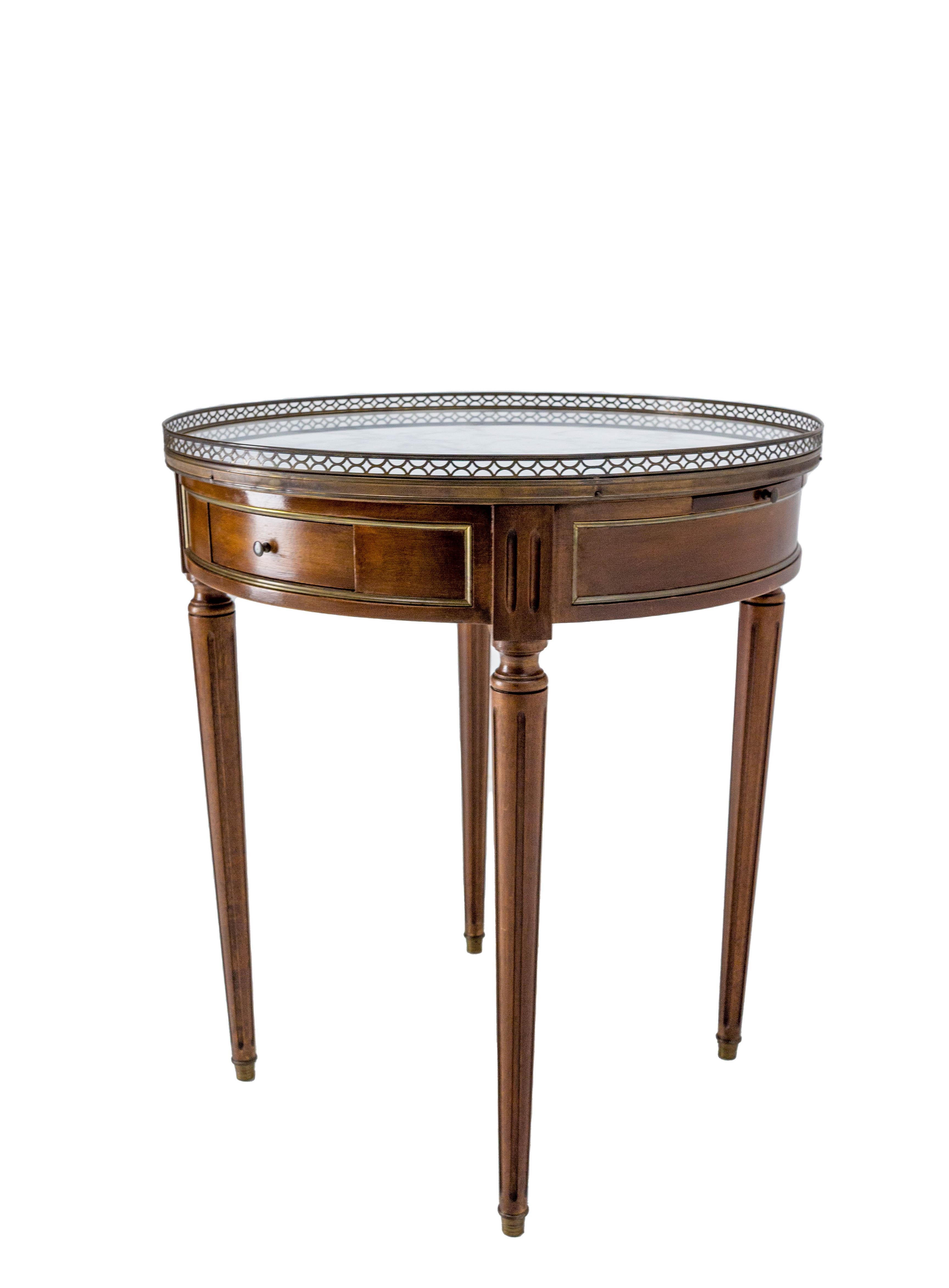Pair of French Louis XVI style bouillotte table with variegated marble-top. 
Brass gallery and fluted legs finished with ormolu feet 
Two drawers and two pull-out tirelles slides.
The name “bouillotte” comes from a French gambling card game that