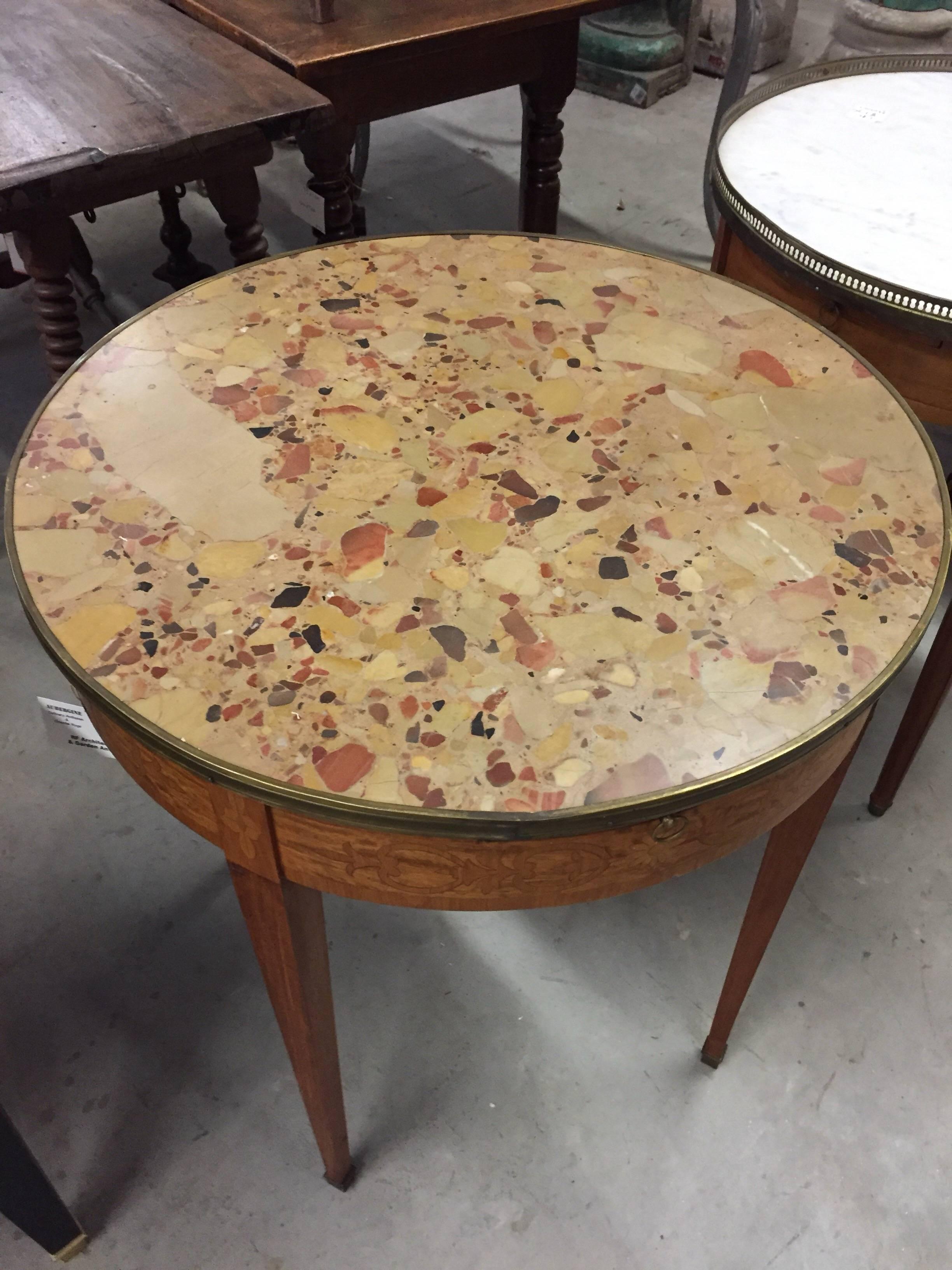 Louis XVI style Bouillotte table. Louis XVI style inlaid bouillotte table with a breche de alep marble top, circa 1920.