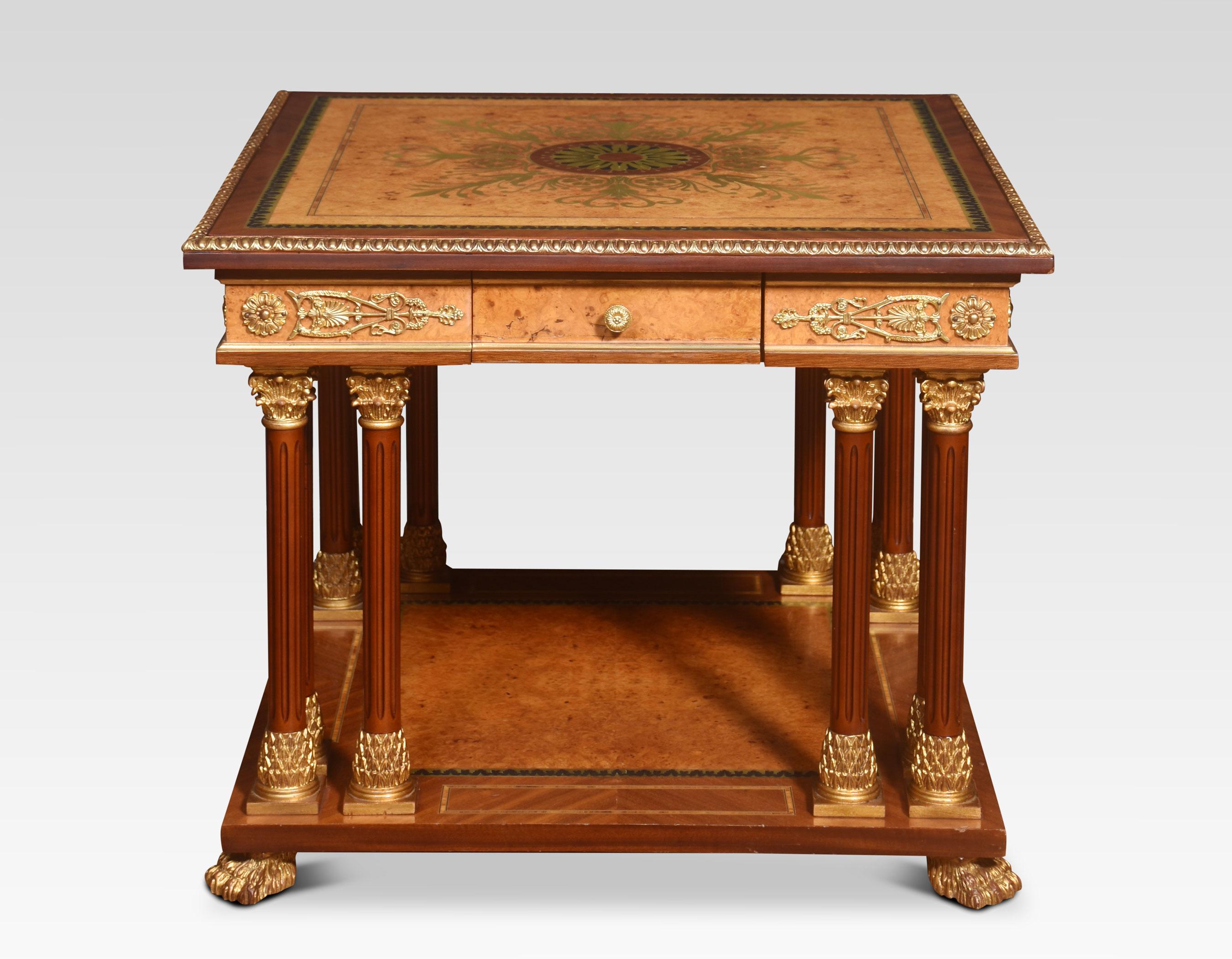 Louis XVI style coffee table, the anthemion brass inlaid top having ebonised border and tooled edge. To the frieze fitted with a drawer. Raised on column legs, gilt metal mounts throughout. Terminating in hairy lion paw feet.
Dimensions
Height 24