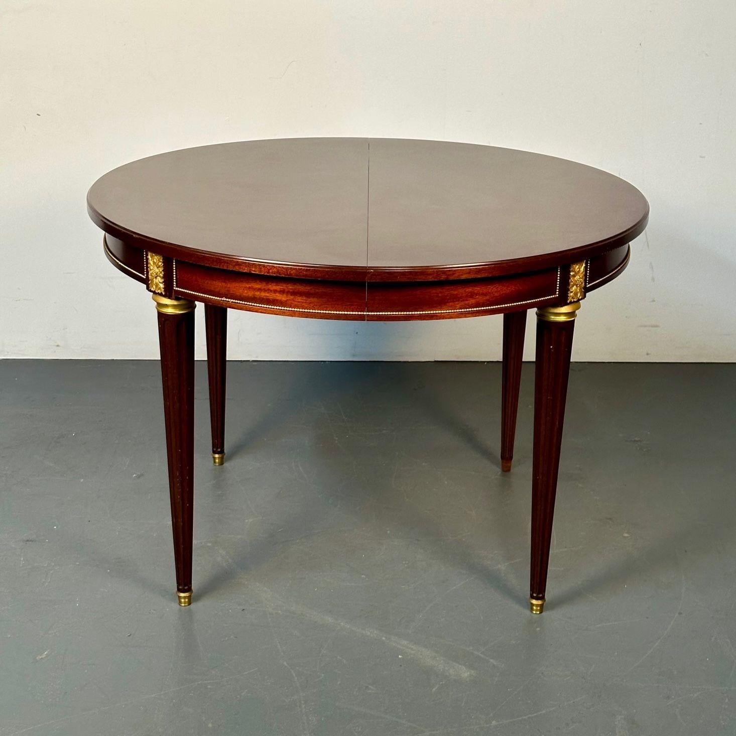 Louis XVI Style Bronze Mounted Center or Dining Table, Plum Pudding Veneer

 
Louis XVI style magnificently bronze mounted plum pudding veneer Centre or Dining Table having three insertable 19.5