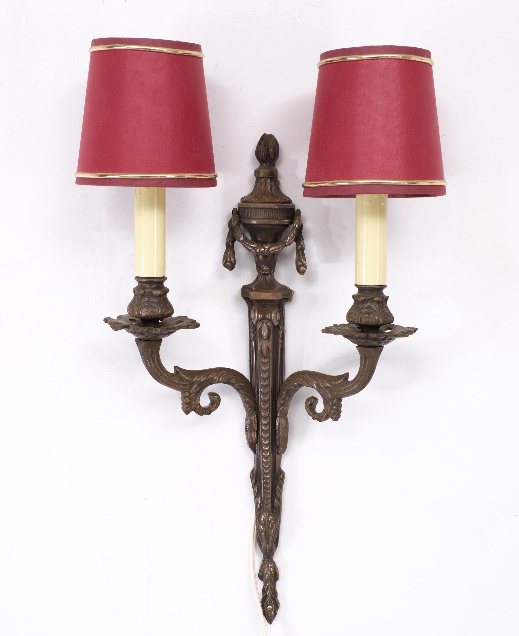 Very nice set of Bronze wall Sconces .  Louis XVI Style  Sconces, Set of 2
.Small socket bulbs needed ,comes with Red Silk shades .1970s  France 



