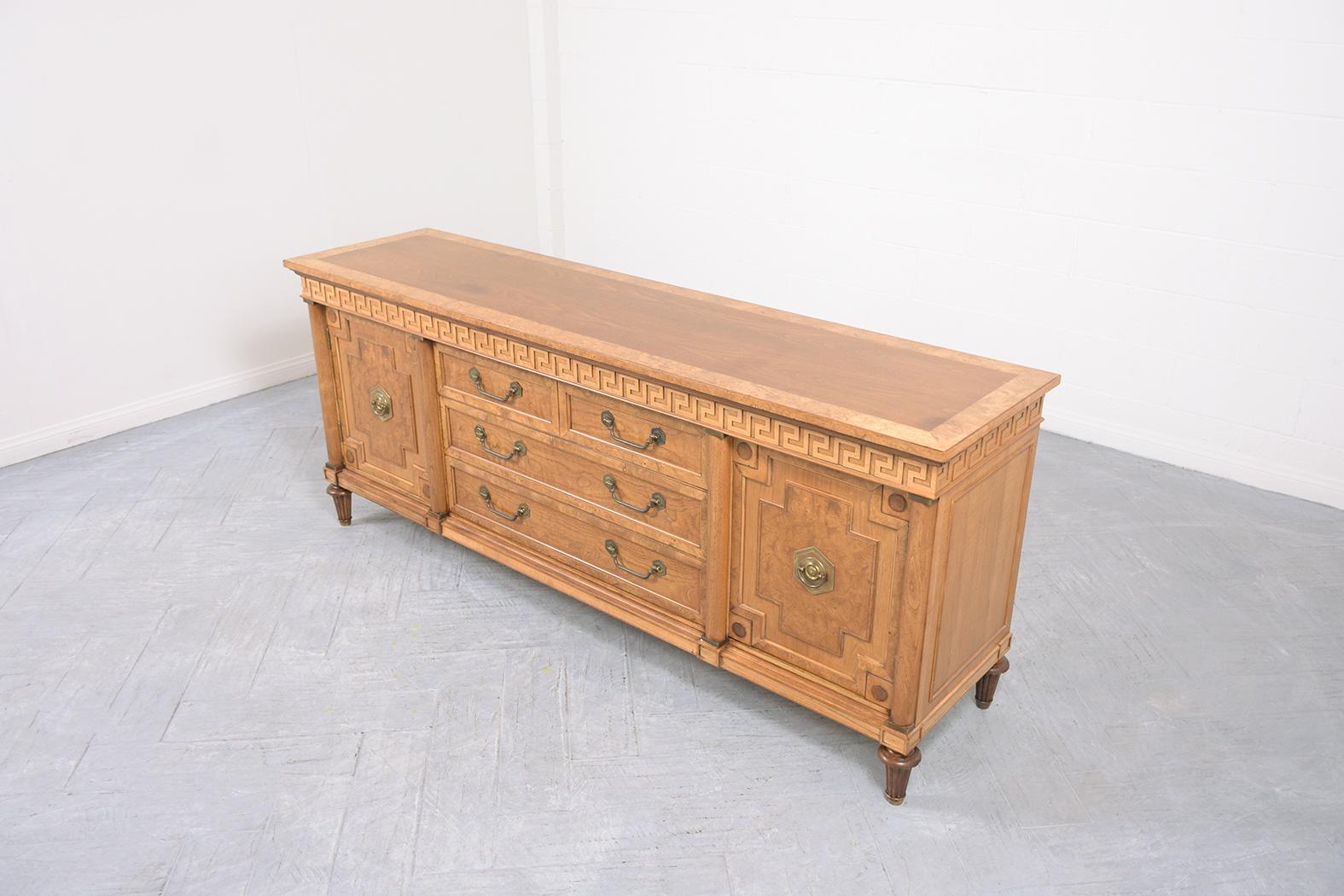 Embrace classic elegance with our 1960s vintage Louis XVI style buffet, meticulously handcrafted from rich walnut wood. This standout piece, in great condition, has been expertly restored by our in-house team of professional craftsmen, ensuring its