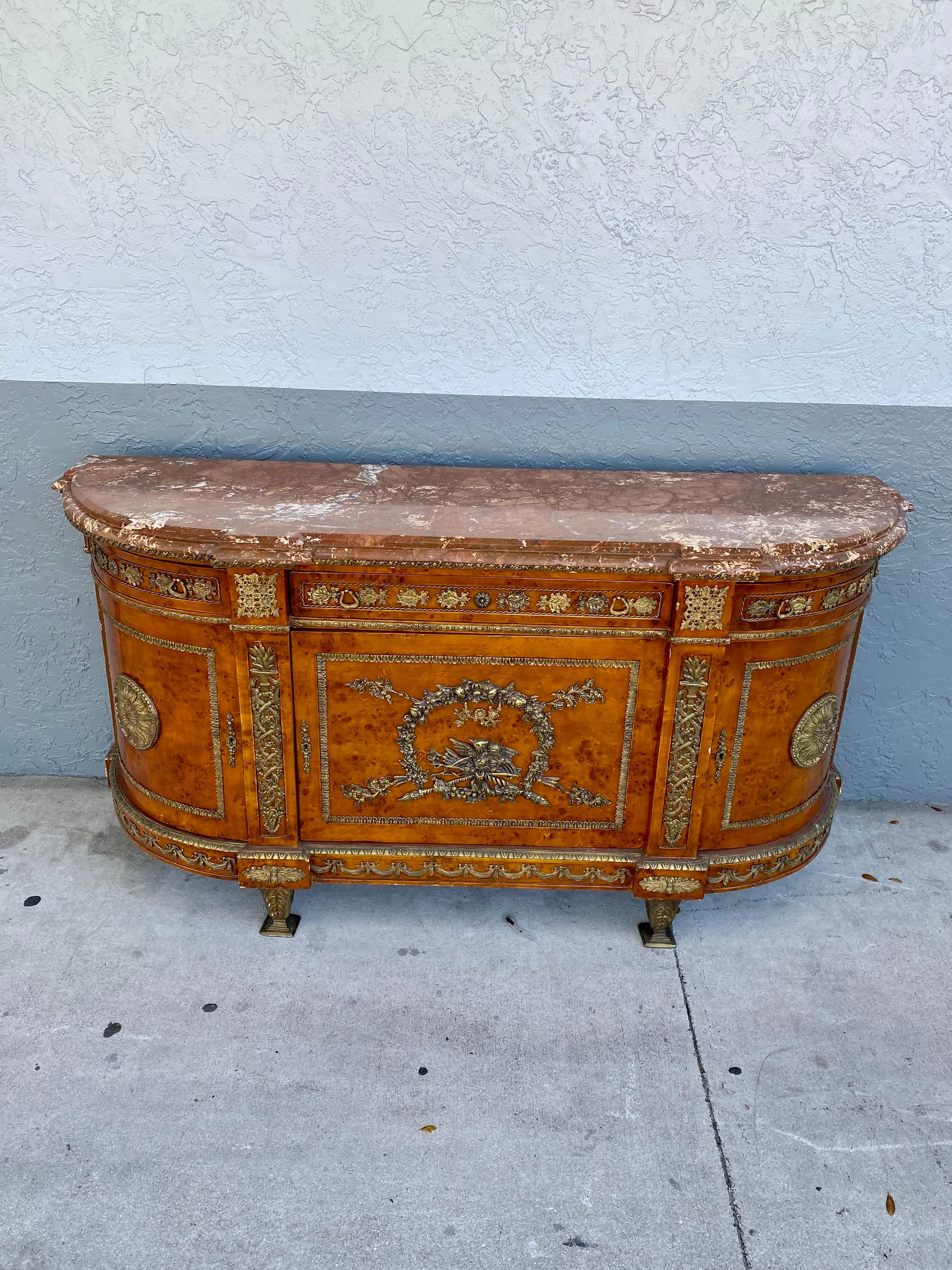 Extremely rare and one of a marble and bronze buffet. Outstanding design is exhibited throughout. Just look at the gorgeous curves on this beauty! A handsome French 19th century Louis XVI st.  buffet. The rounded side buffet with two top doors and