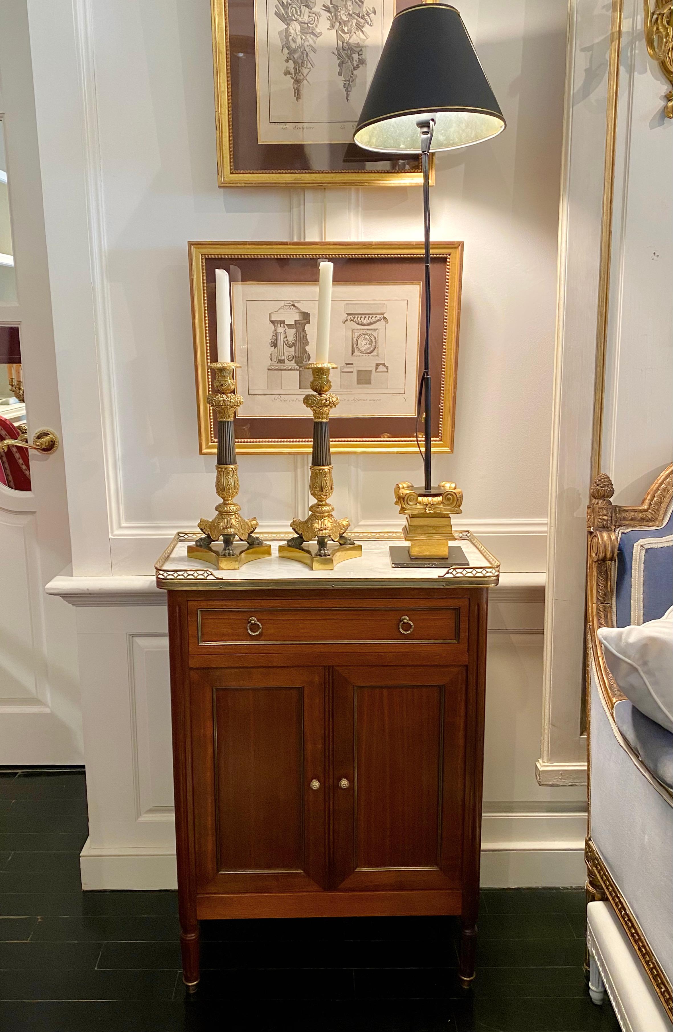 Louis XVI Style versatile cabinet or small cubboard with marble top and bronze gallery. Rectangular white marble top with rounded corners surrounded by a bronze pierced gallery. The cabinet has a drawer above a pair of doors opening unto shelves. It