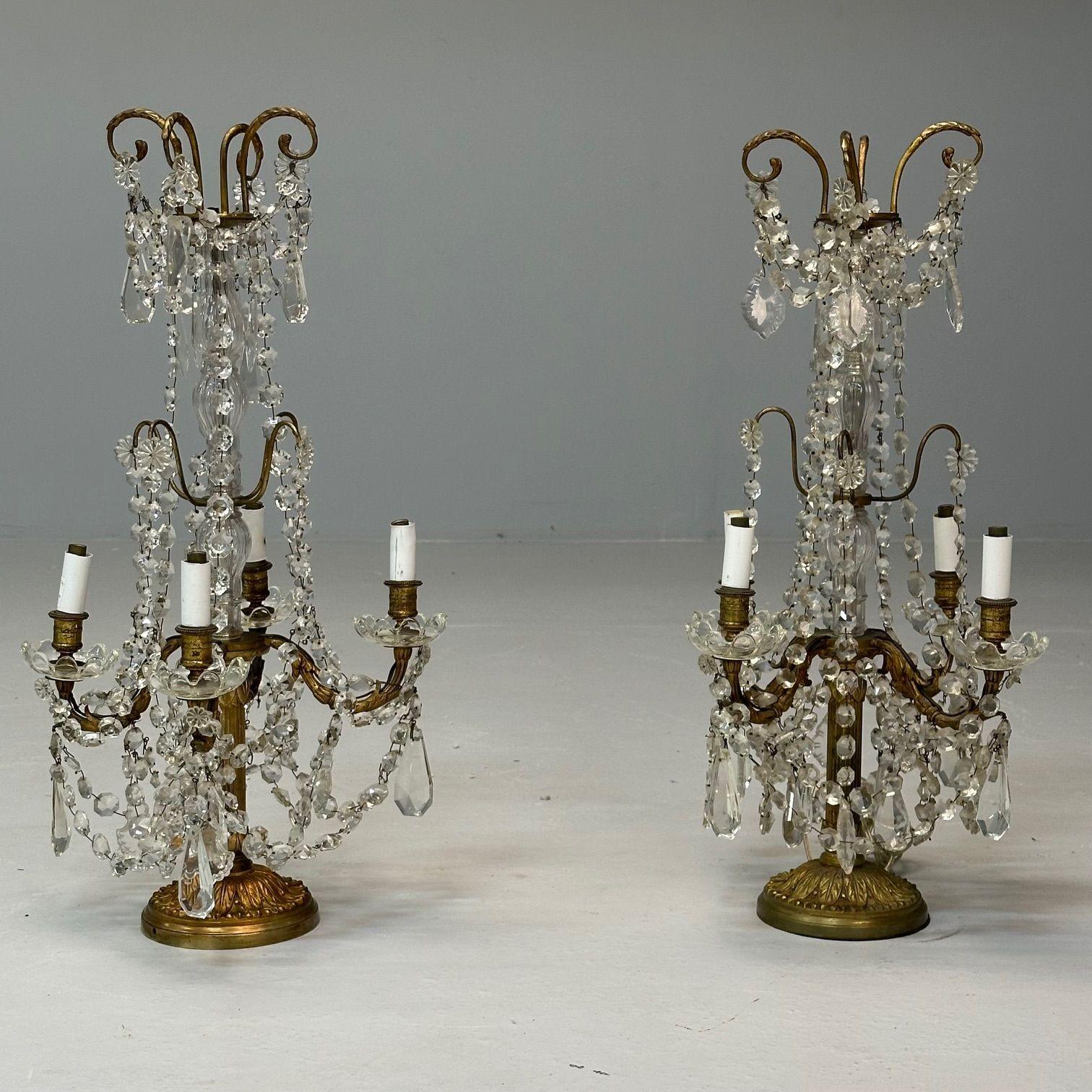 Louis XVI Style, Candelabras, Gilt Bronze, Crystal, France, 1960s

Each having four lights one wired and one not wired. The base strong and sturdy with hanging crystals. The pair in need of minor tlc. Some crystals may be missing, however, we can