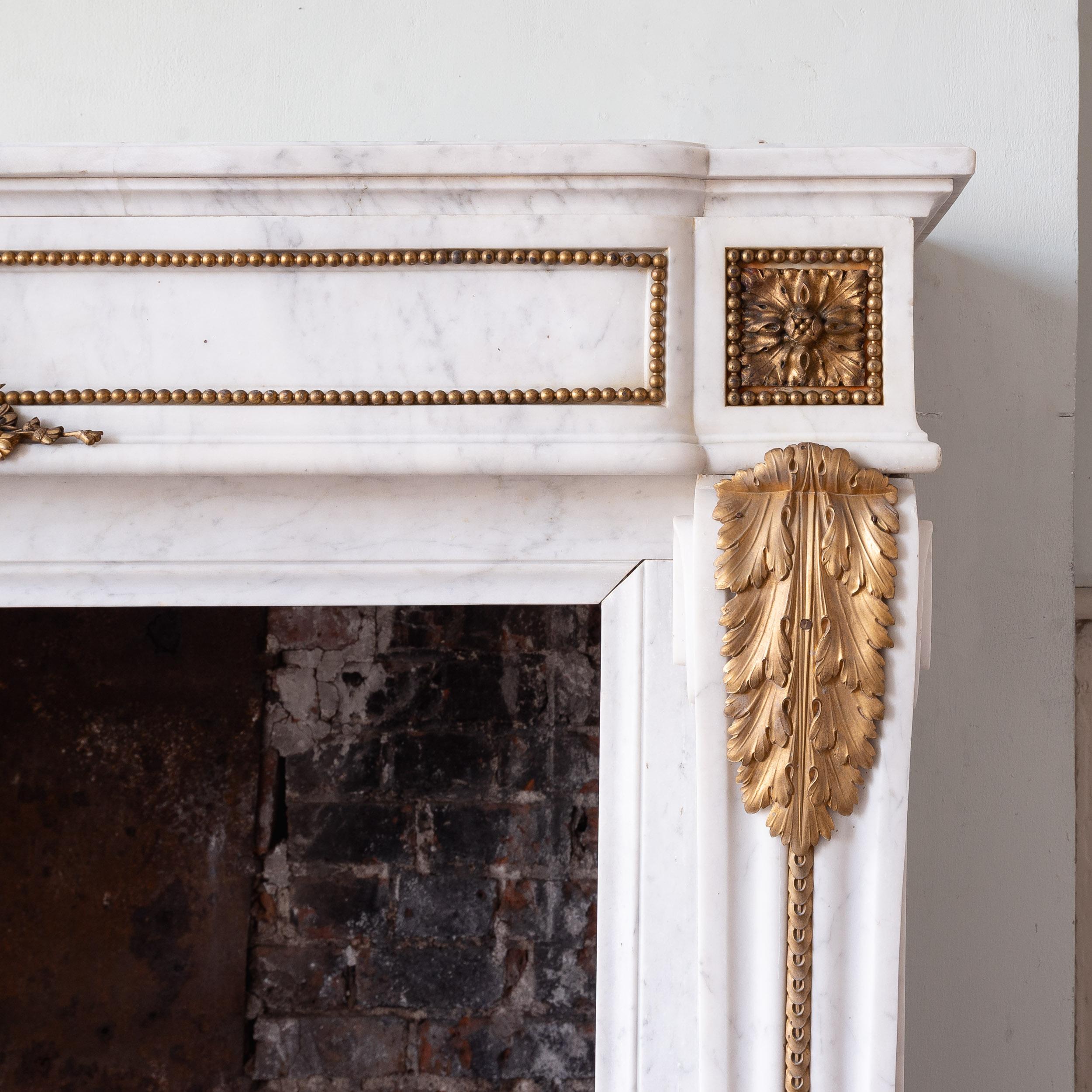 French Louis XVI Style Carrara Marble and Ormolu Mounted Fireplace For Sale