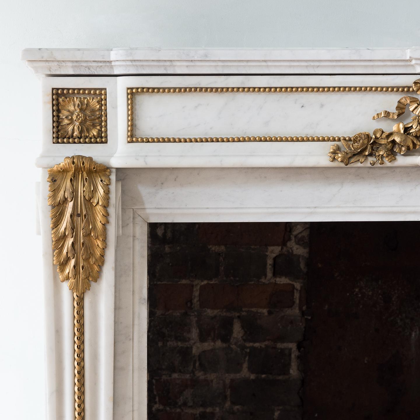 French Louis XVI Style Carrara Marble and Ormolu Mounted Fireplace For Sale