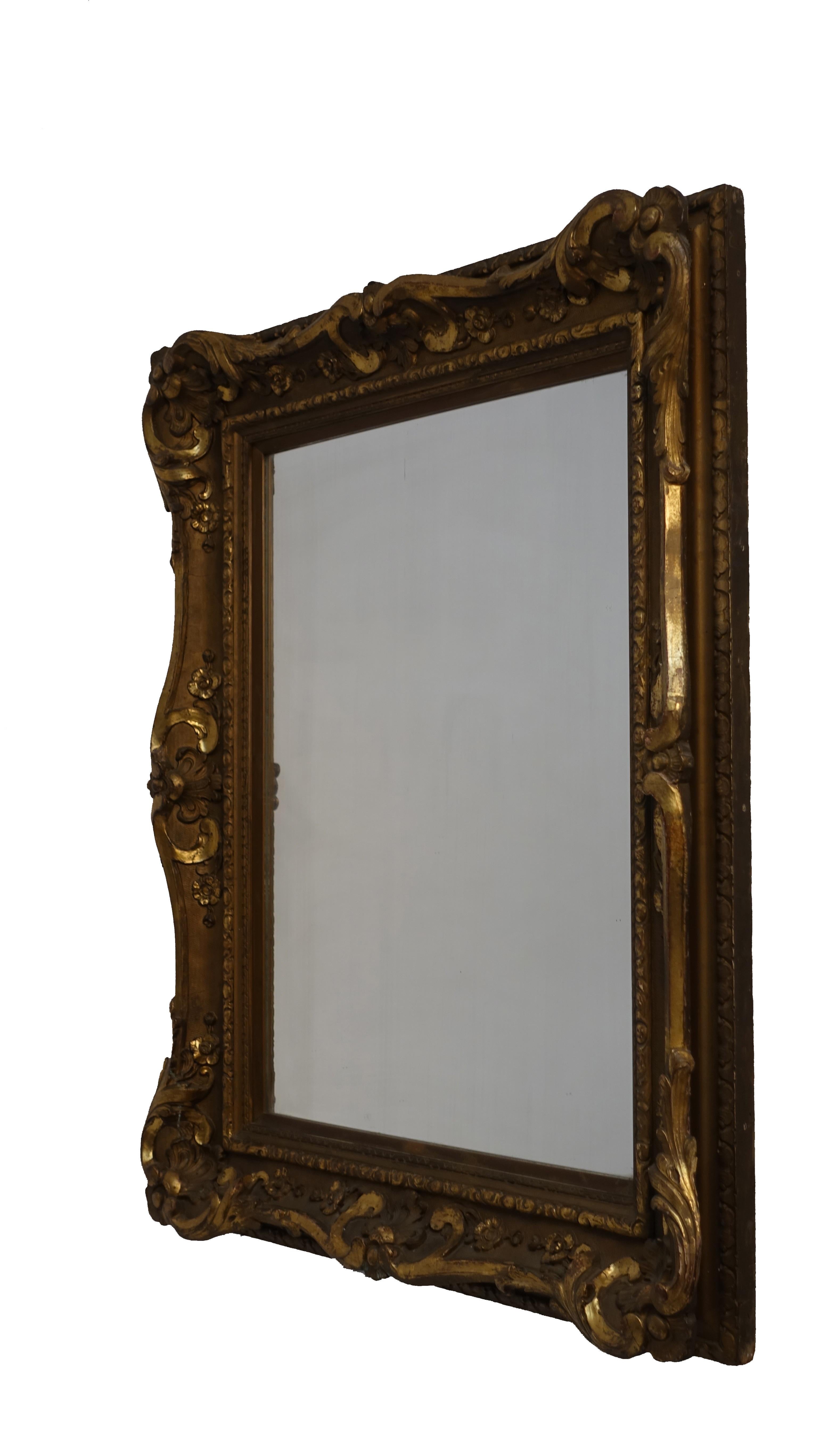 Louis XVI style carved, gessoed and gilt mirror. Continental, mid-19th century.
