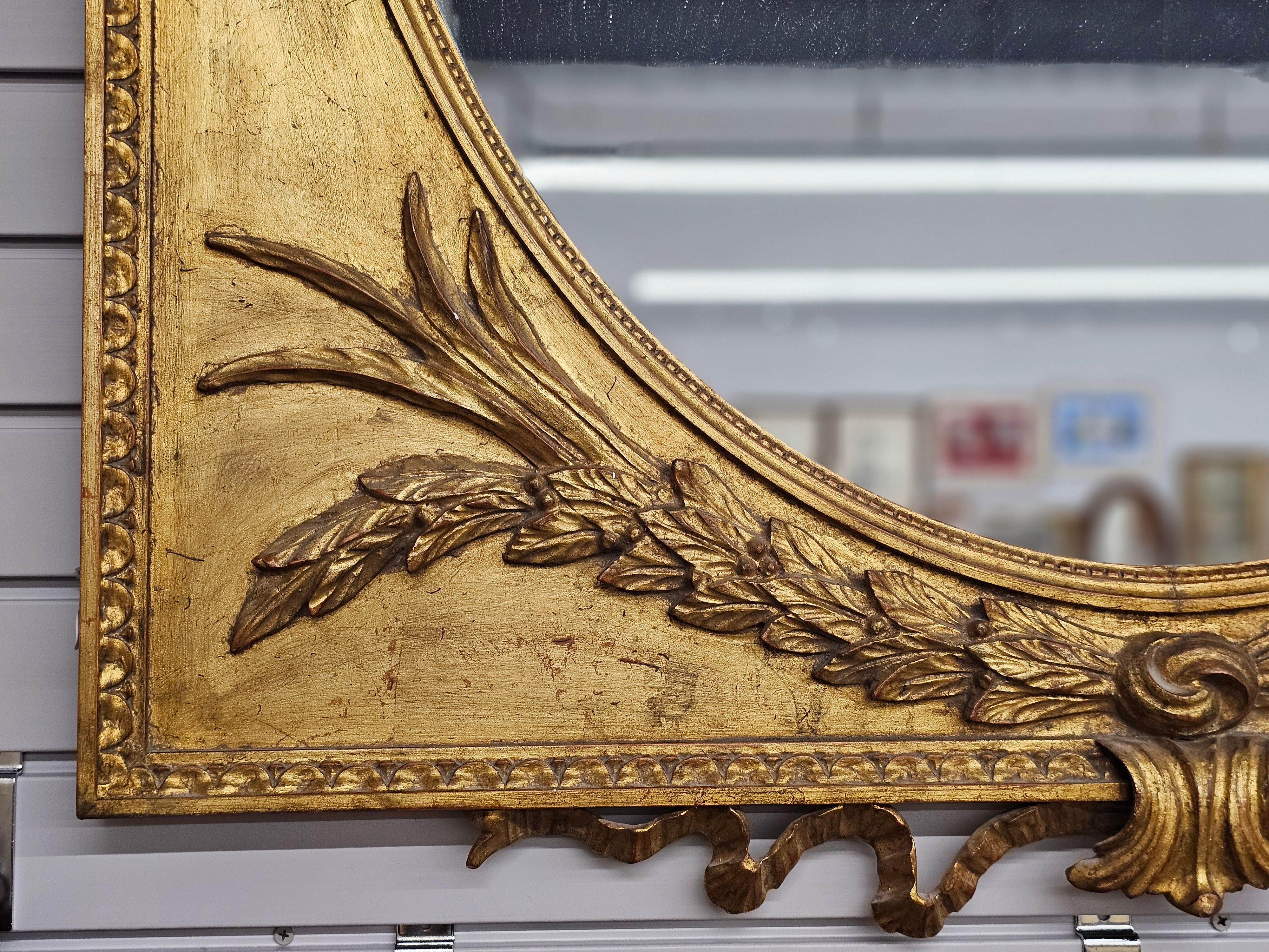 Stained Louis XVI Style Carved and Ornate Giltwood  Frame Mirror For Sale