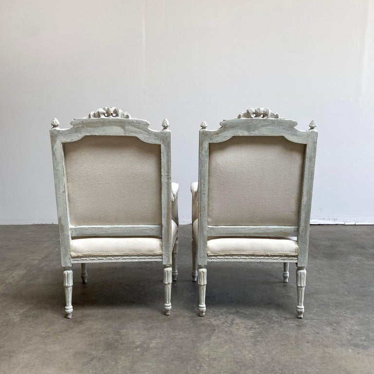 20th Century Louis XVI Style Carved and Painted Open Arm Chairs For Sale