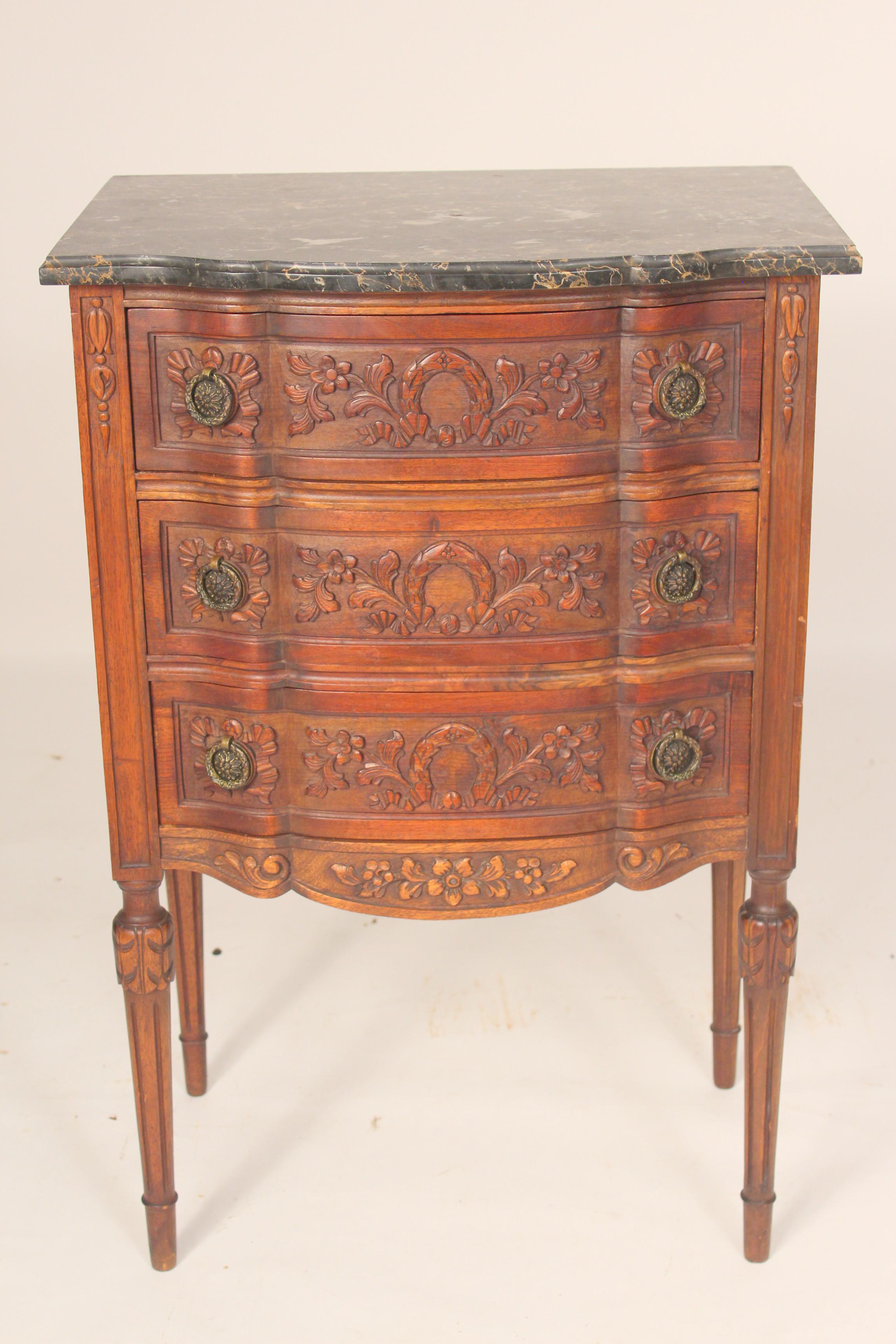 Louis XVI style carved walnut chest of drawers with marble top, circa 1920.