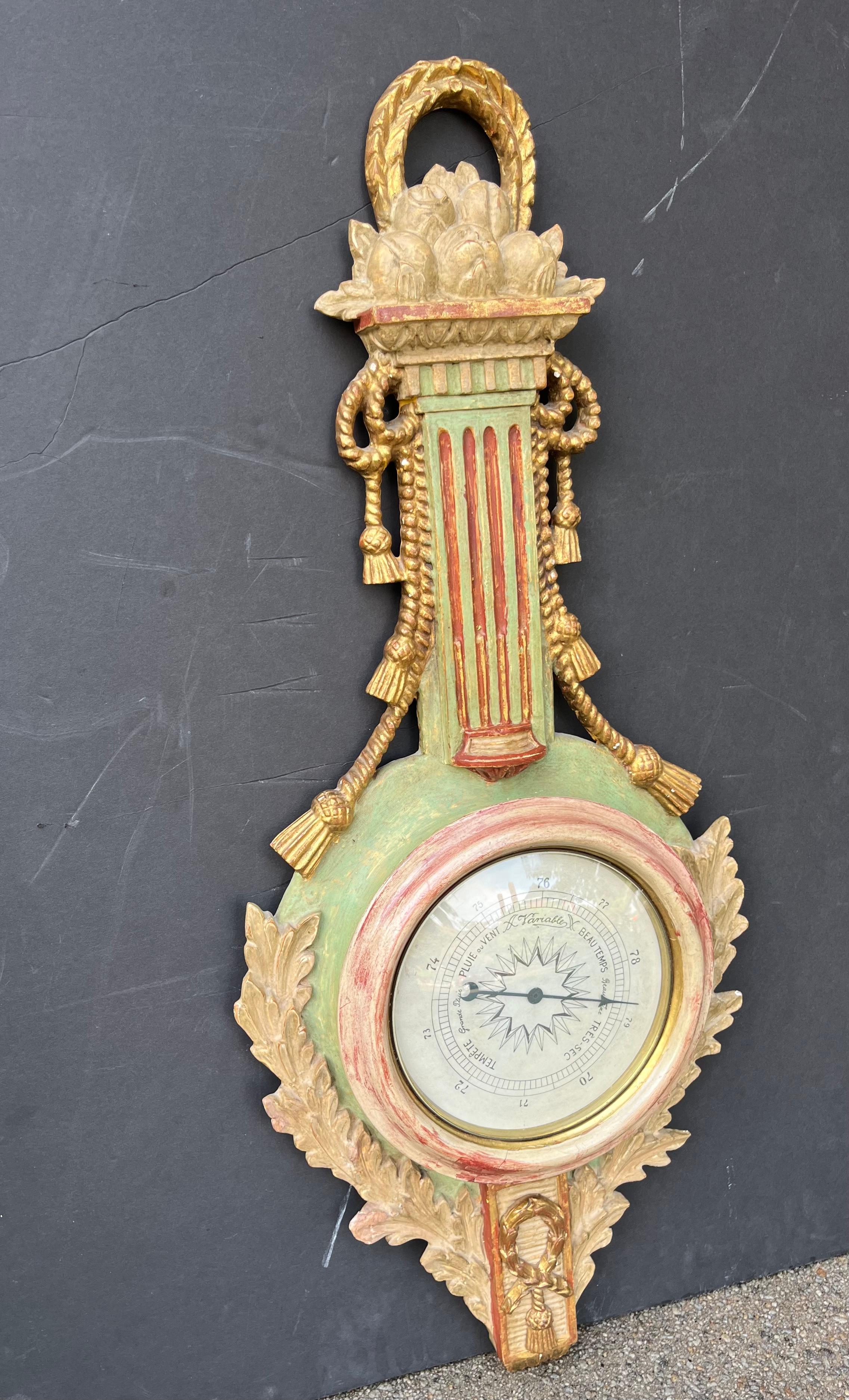 A pretty and highly decorative barometer of banjo form,  marked ‘Palladio’  and Italy . Hand carved with leaves , ropes , fruit and flutes .

The case probably having distressed finish ( to have aged look ) when created ,has further wear and