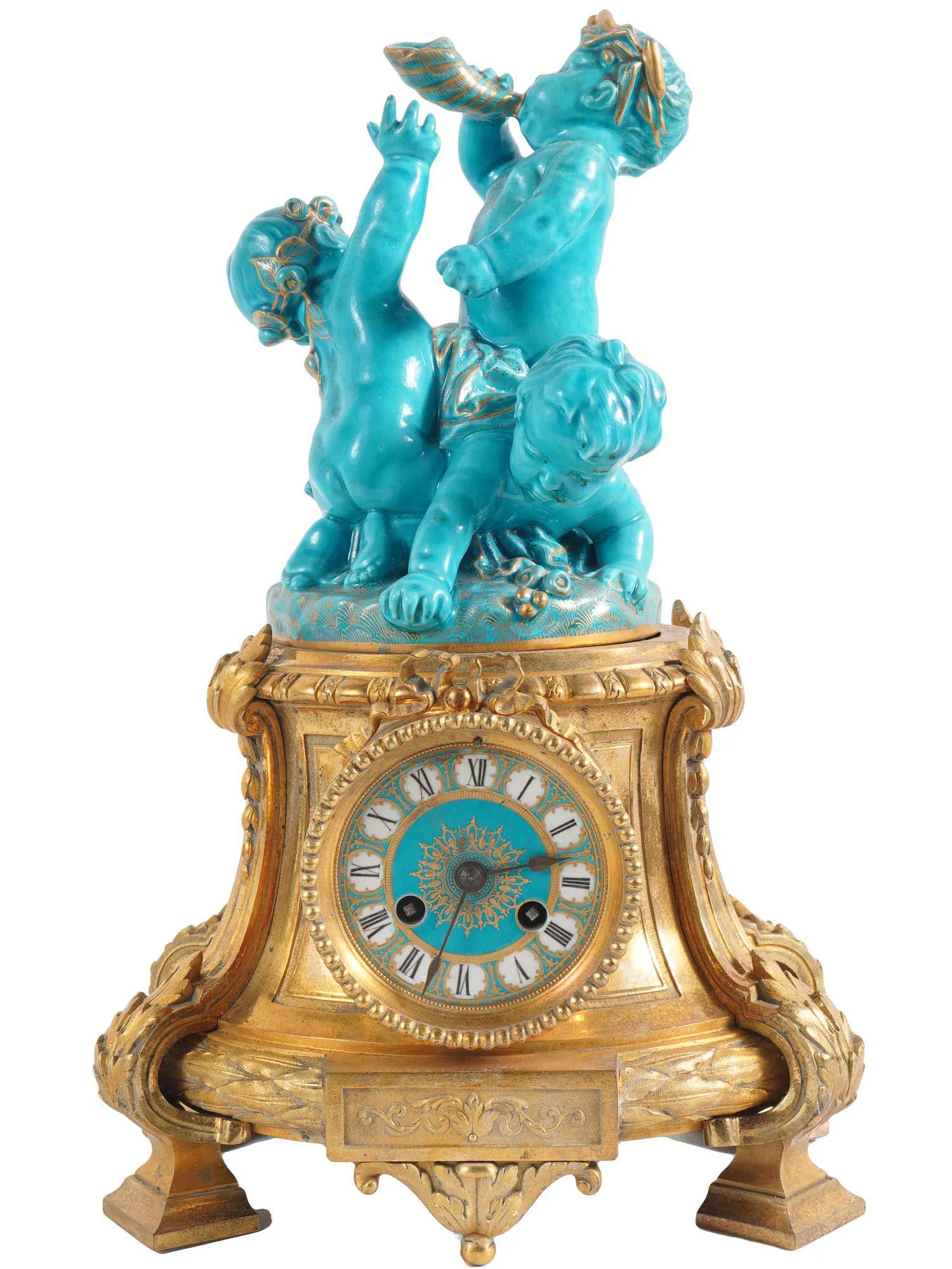 Very fine quality 19 century French Louis XVI Style celest blue sevres porcelain and bronze putti clock Garniture set.
Consisting of a clock and a pair of candelabras.