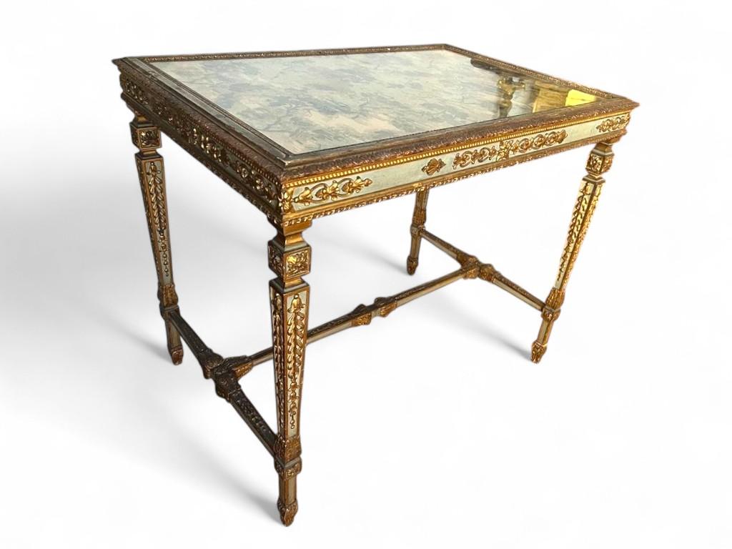Italian Louis XVI Style Center Table or Desk in Lacquered and Gilded Wood, 19th Century

This exceptional Italian center table or desk exemplifies the refined elegance of the Louis XVI style, beautifully executed in lacquered wood with a delicate