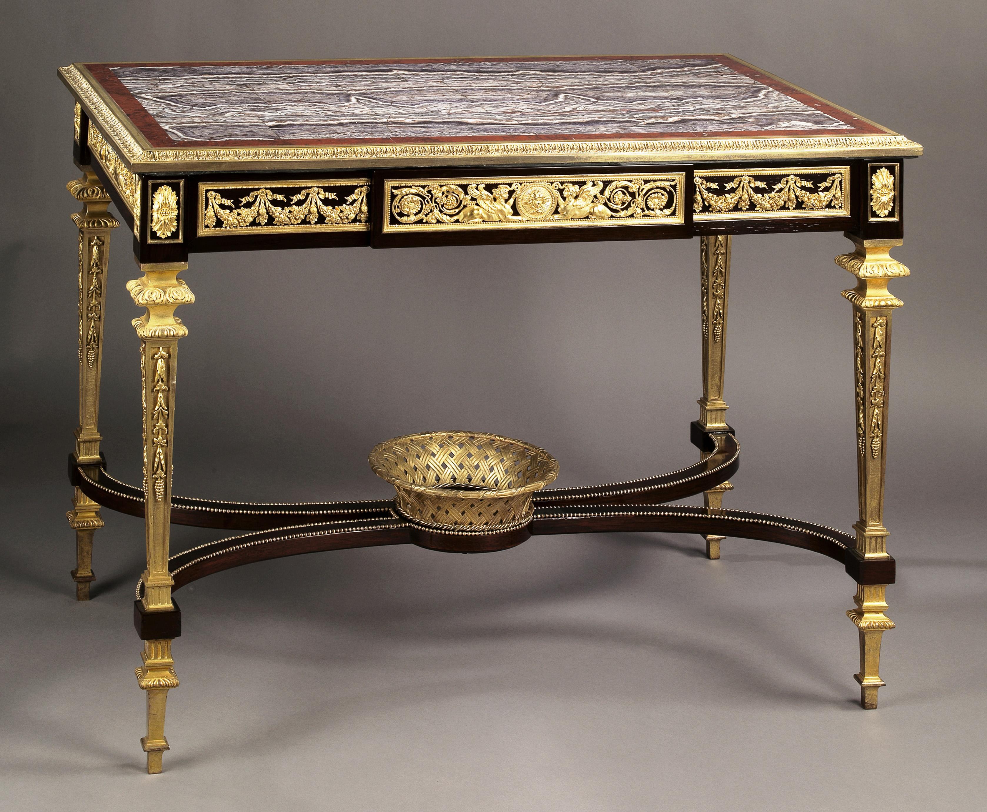 An exceptional Louis XVI style gilt-bronze mounted centre table in the manner of Adam Weisweiler, with a rare amethyst quartz marble top.

French, circa 1890.

This refined Louis XVI design is based on the famous dressing table by the