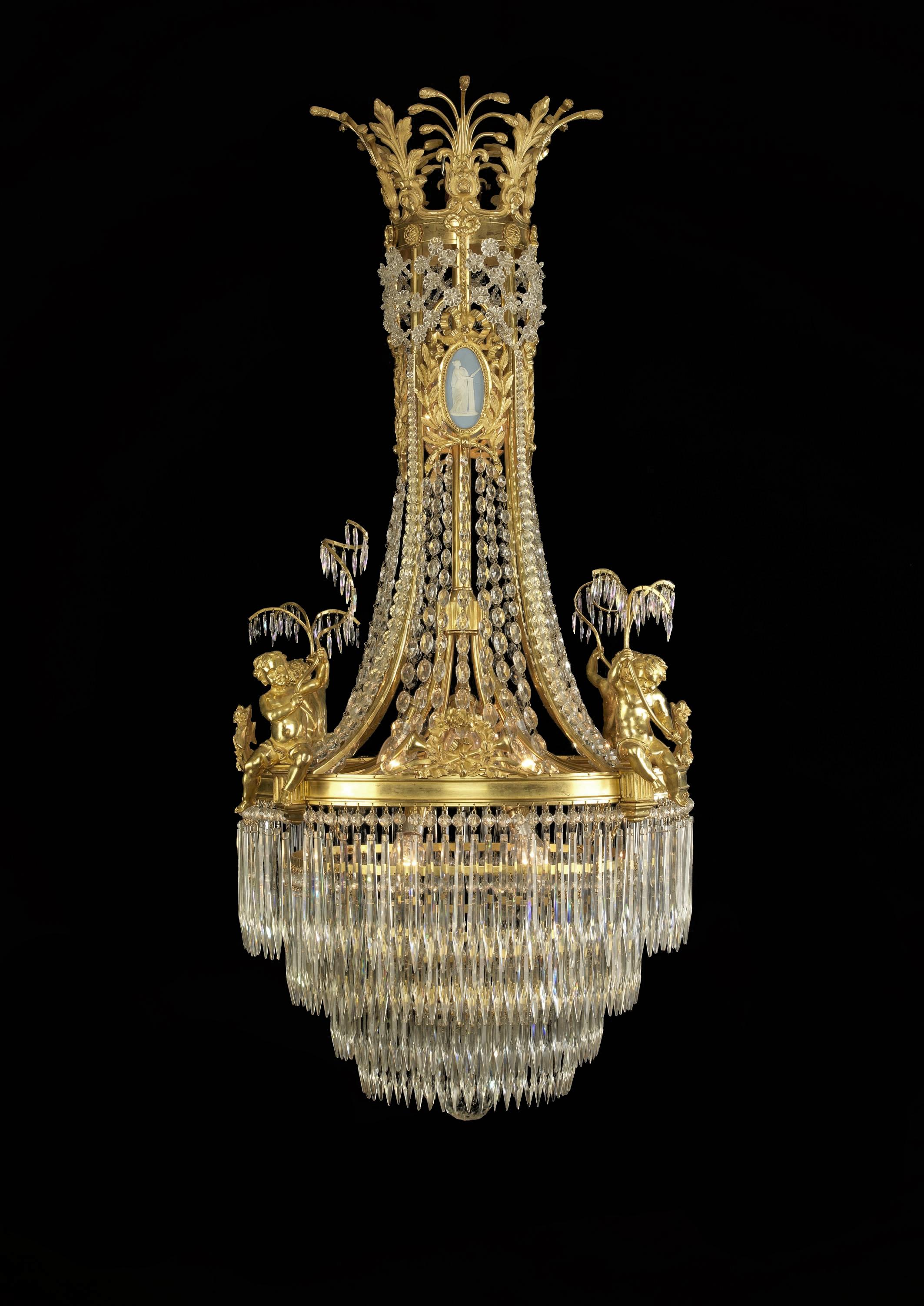 An Important Louis XVI Style cut-glass and gilt bronze-mounted chandelier with Wedgwood style porcelain plaques. 

French, circa 1900. 

This fine chandelier has a gilt bronze corona with a finely cast acanthus and anthemion cresting above an