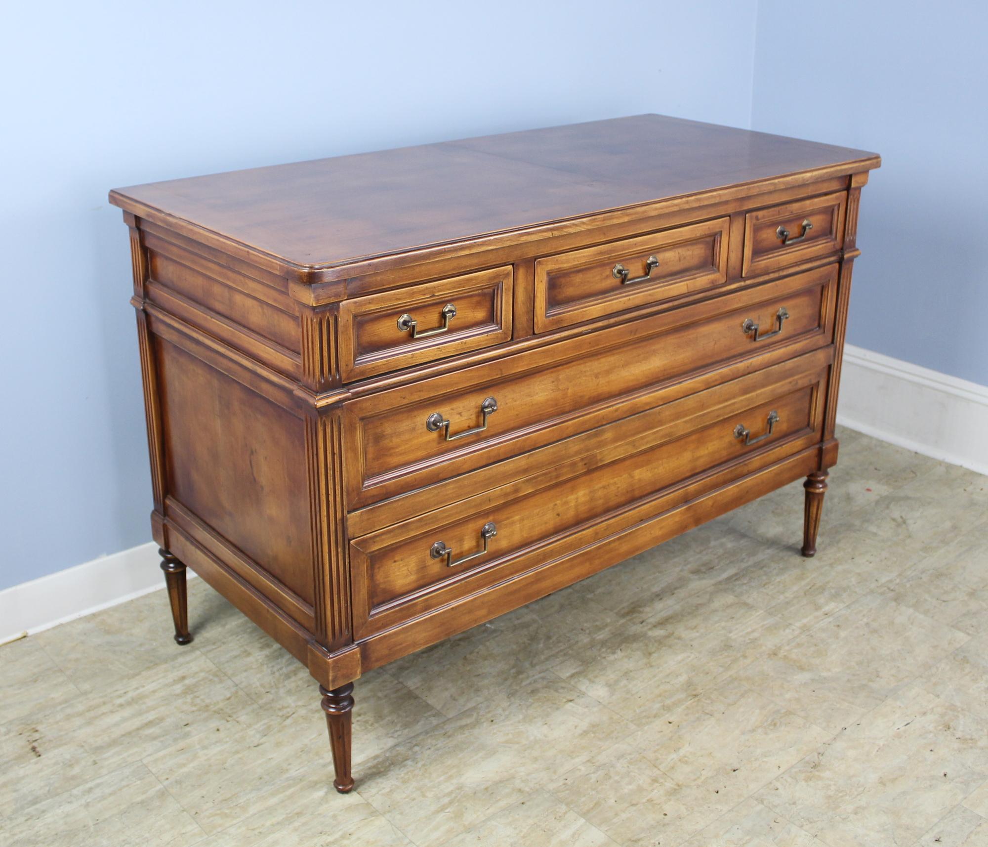 A handsome commode recently made in England. Excellent carved detail and pretty cherrywood with high quality hardware and construction.