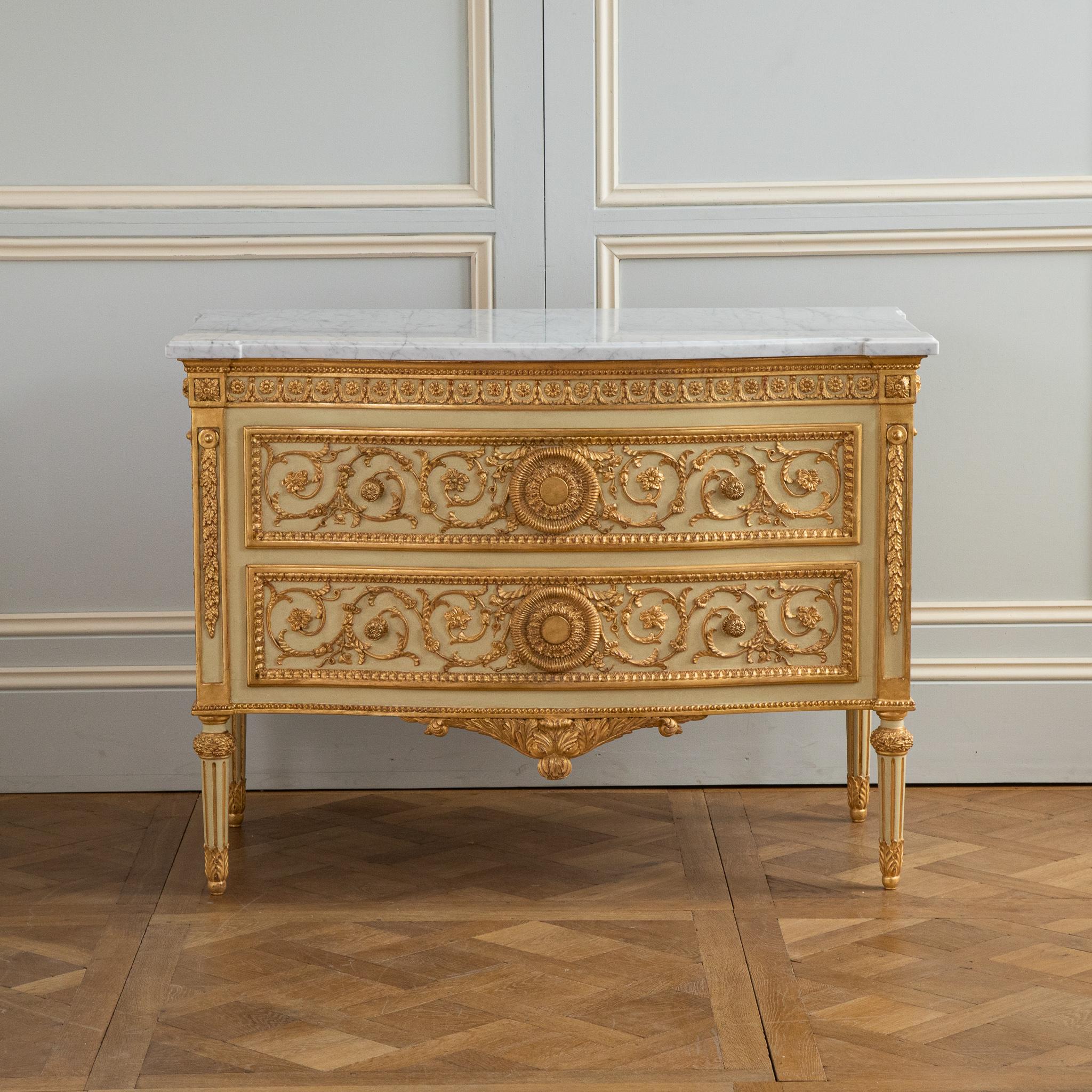 Hand carved and Hand finished Louis XVI style commode in polychrome finish.
Painted in a light French green with gold highlights.
with a 30mm Carrara Marble top
Fine details all around inspired by ancient Greece motifs.