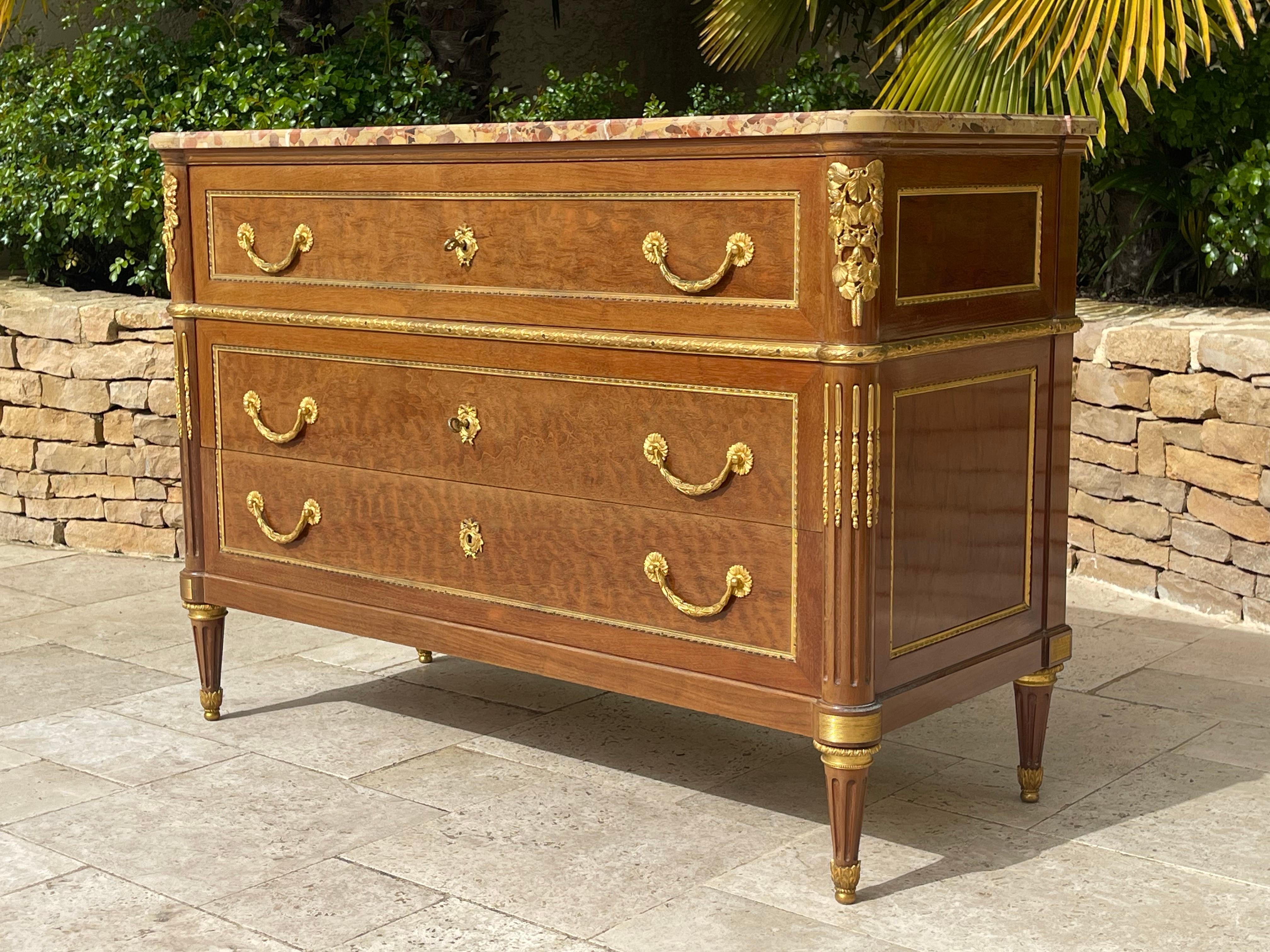 Very pretty Louis XVI style chest of drawers in mahogany and gilded bronzes with Aleppo breccia marble top. It opens onto 3 drawers mounted on solid oak with dovetail assembly French Parisian Tracail from Faubourg Saint Antoine circa 1940.